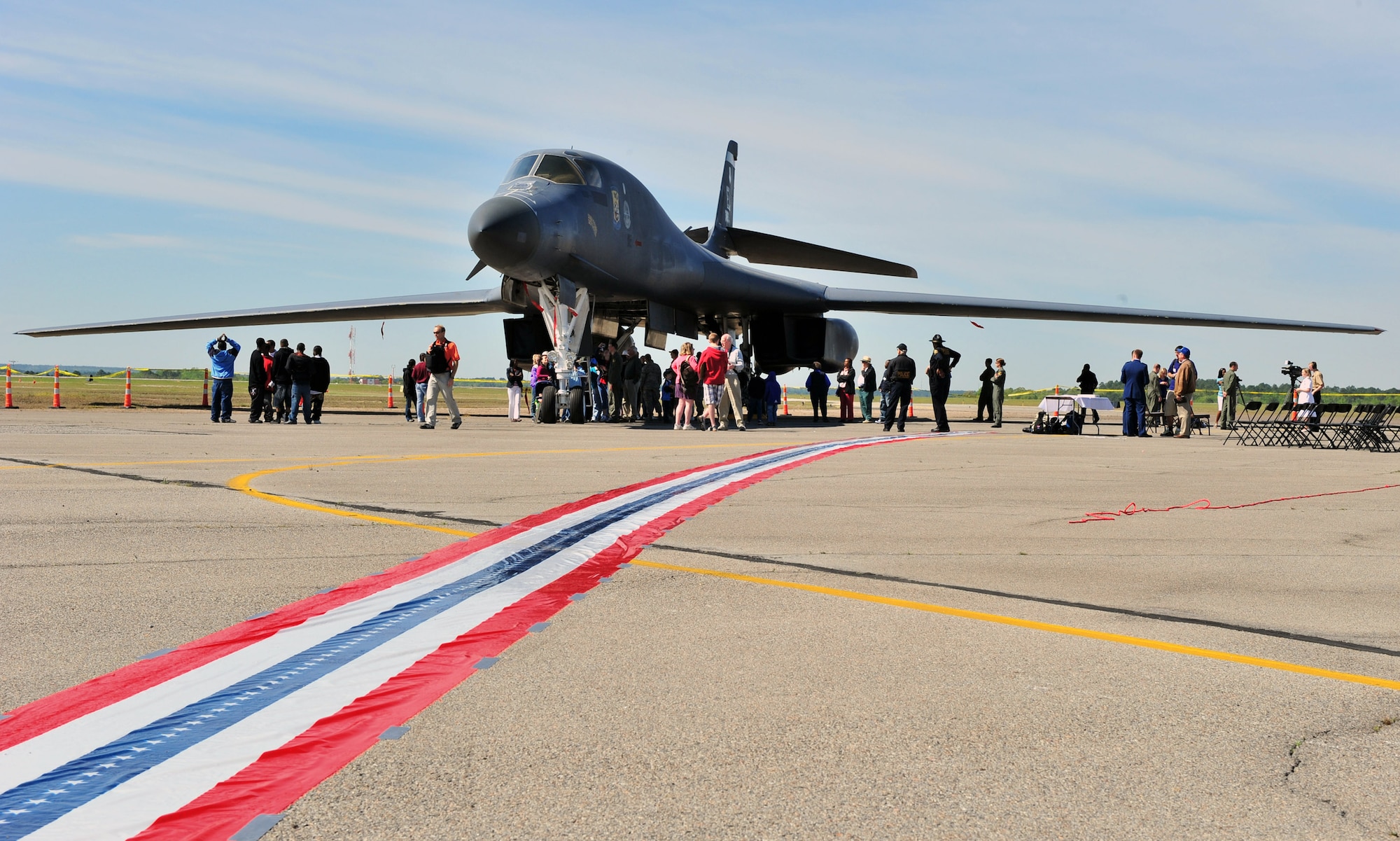 A 467-foot ribbon commemorating the take-off distance the Doolittle Raiders had on the USS Hornet, leads from a hangar door to a B-1 Lancer.  It was part of the celebration at Columbia Metro Airport in Columbia, S.C., during the 67th Doolittle Raider Reunion.  The 34th Bomb Squadron bomber was flown in from Ellsworth Air Force Base, S.D.  (U.S. Air Force Photo/Senior Airman William Coleman)