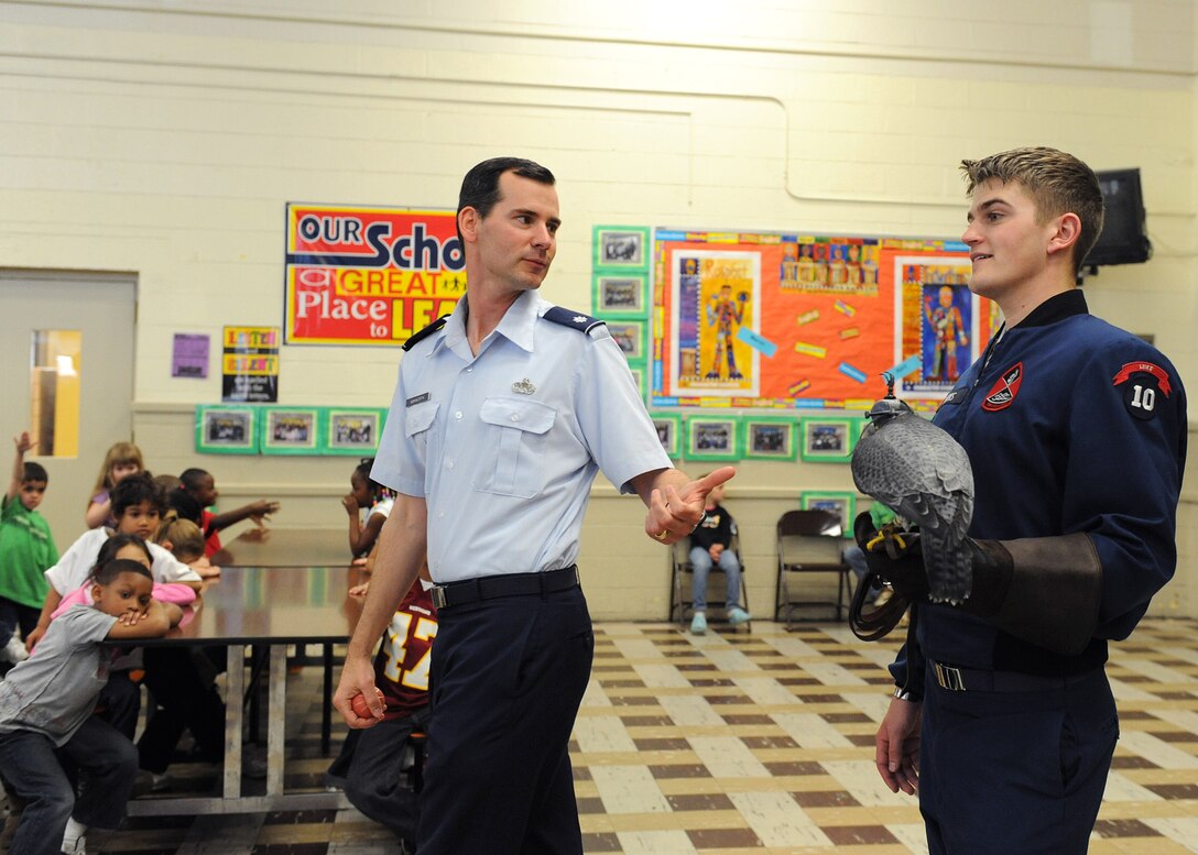 LANGLEY AIR FORCE BASE, Va— Lt. Col. Brett Ashworth, United States Air Force Academy public affairs director, and Cadet Ryan Kerns, USAFA junior and falconer, show the children of Alfred Forrest Elementary School in Hampton, Va. the academy’s school ambassador “Havoc”, a Peregrine Falcon April 20. Colonel Ashworth and Cadet Kerns are visiting schools during Air Force Week to educate students about the Air Force. (U.S. Air Force photo/Airman 1st Class Gul Crockett)