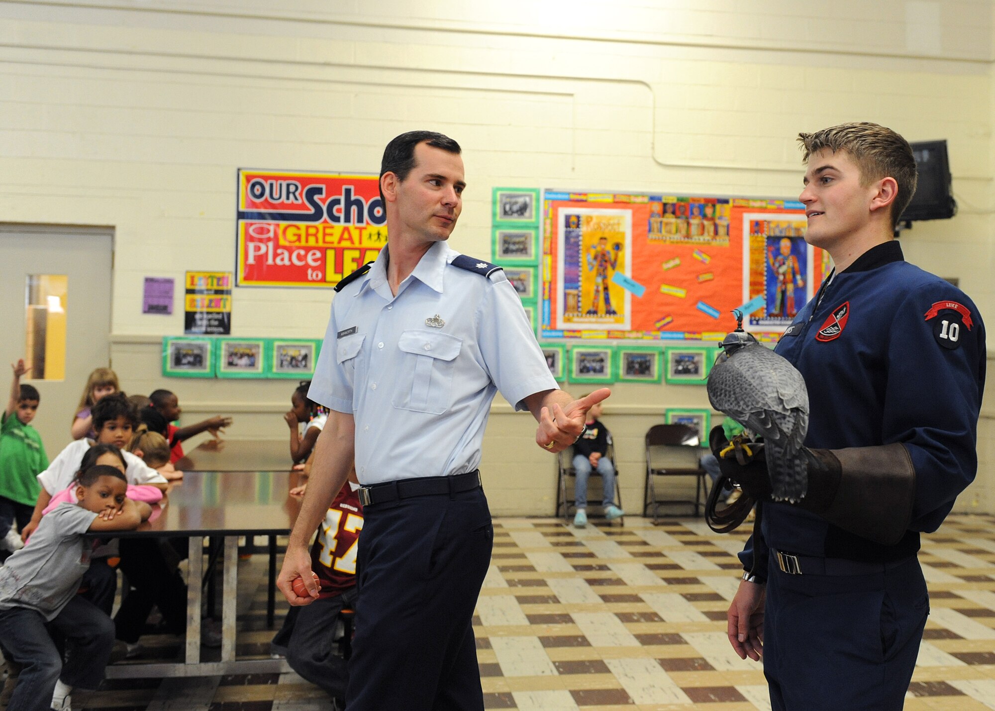 LANGLEY AIR FORCE BASE, Va— Lt. Col. Brett Ashworth, United States Air Force Academy public affairs director, and Cadet Ryan Kerns, USAFA junior and falconer, show the children of Alfred Forrest Elementary School in Hampton, Va. the academy’s school ambassador “Havoc”, a Peregrine Falcon April 20. Colonel Ashworth and Cadet Kerns are visiting schools during Air Force Week to educate students about the Air Force. (U.S. Air Force photo/Airman 1st Class Gul Crockett)