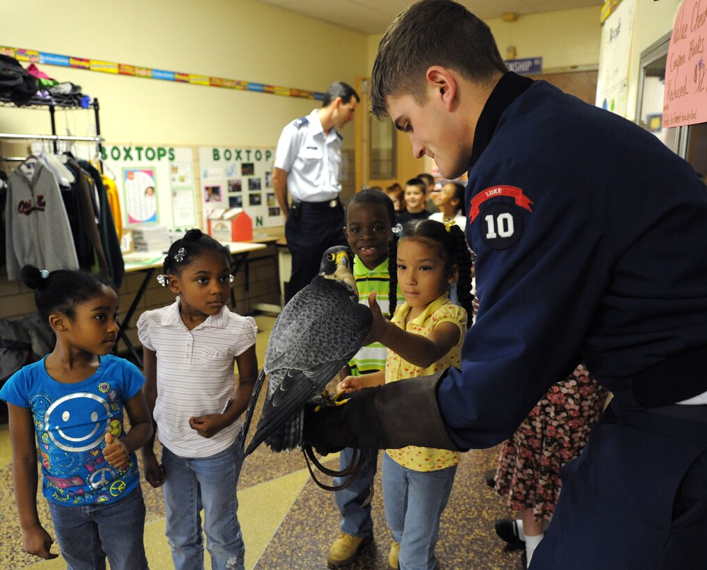 LANGLEY AIR FORCE BASE, Va.-- Cadet Ryan Kerns, United States Air Force Academy junior and falconer, shows the children of Alfred Forrest Elementary School in Hampton, Va.  the academy’s school bird ambassador "Havoc", a Peregrine Falcon April 20.  Cadet Kerns and Lt. Col. Brett Ashworth, USAFA public affairs director, are visiting schools during Air Force Week to educate students about the Air Force. (U.S. Air Force photo/Airman 1st Class Gul Crockett)