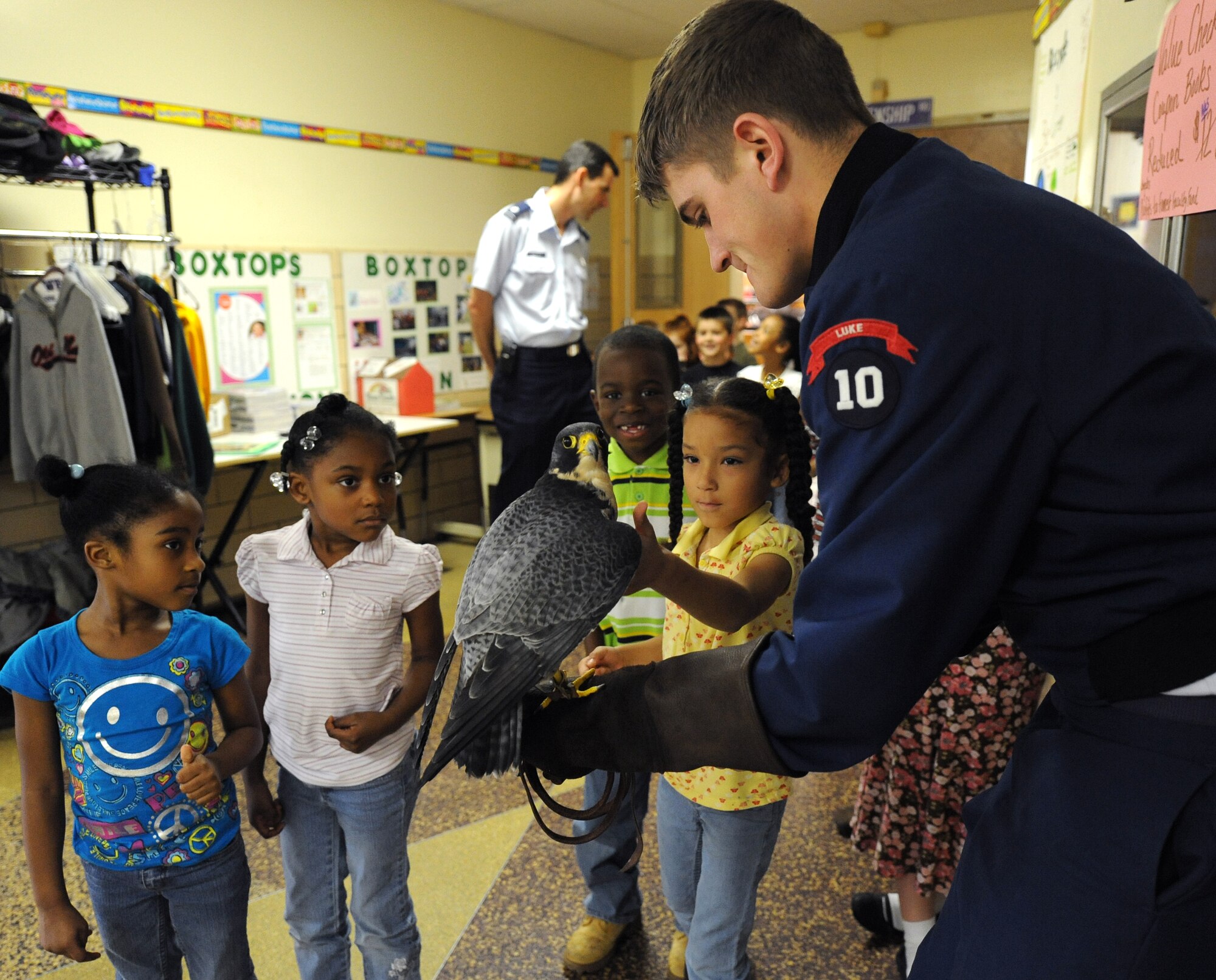 LANGLEY AIR FORCE BASE, Va.-- Cadet Ryan Kerns, United States Air Force Academy junior and falconer, shows the children of Alfred Forrest Elementary School in Hampton, Va.  the academy’s school bird ambassador "Havoc", a Peregrine Falcon April 20.  Cadet Kerns and Lt. Col. Brett Ashworth, USAFA public affairs director, are visiting schools during Air Force Week to educate students about the Air Force. (U.S. Air Force photo/Airman 1st Class Gul Crockett)