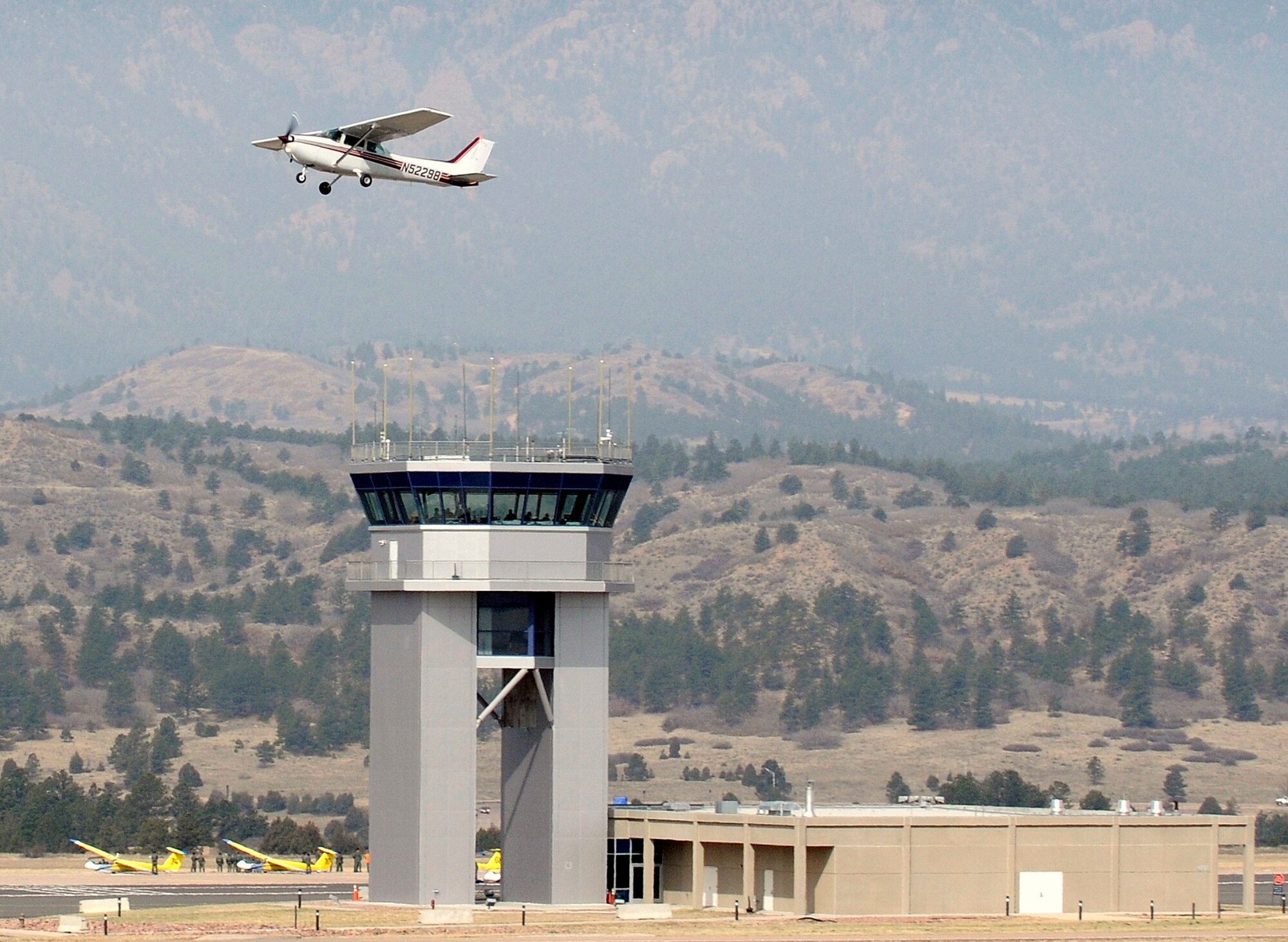 Cadet for a Day Joe Hayford soars past the air control tower on the U.S. Air Force Academy grounds. Cadet Hayford's ride was sponsored by cadet squadron 4, and organized by the Make-A-Wish foundation.  (U.S. Air Force photo/Mike Kaplan)