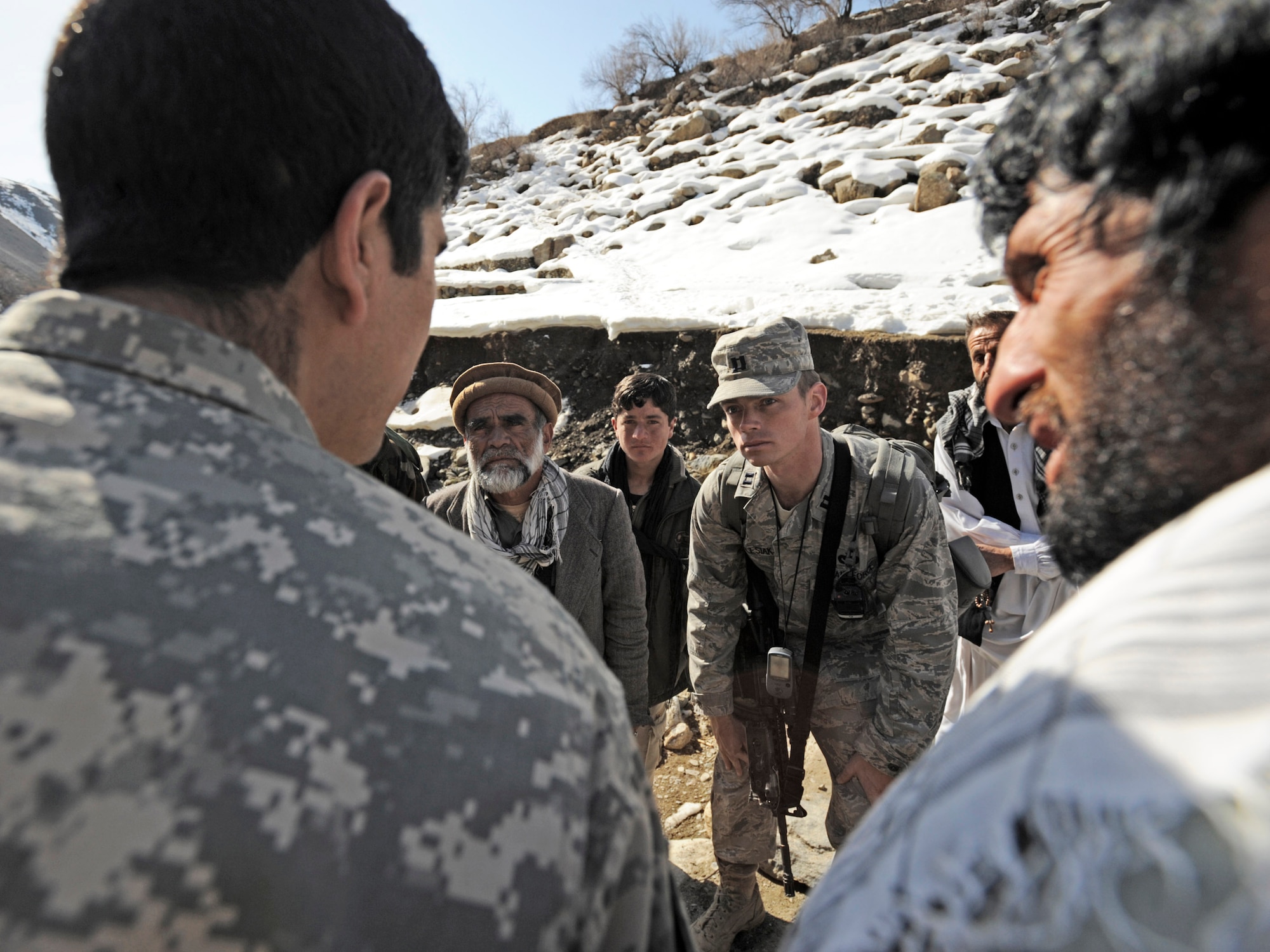 Capt. Patrick Kolesiak talks with local villagers about energy issues in Afghanistan in Panjshir, Afghanistan. Captain Kolesiak is the Panjshir Provincial Reconstruction Team lead civil engineer. (U.S. Air Force photo/Staff Sgt. James L. Harper Jr.) 
