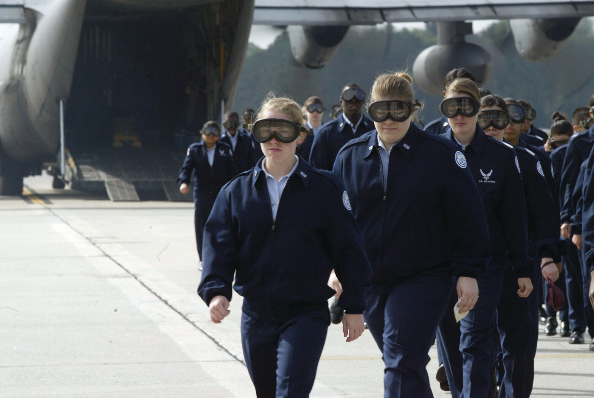 A group of U.S. Air Force JROTC cadets from a local Atlanta, Ga., high school depart a C-130 aircraft after an orientation flight April 15.  More than 1,000 cadets flew on the aircraft and visited static displays inside a hangar April 14-15 to learn about careers in the U.S. Air Force. (U.S. Air Force photo/Don Peek)