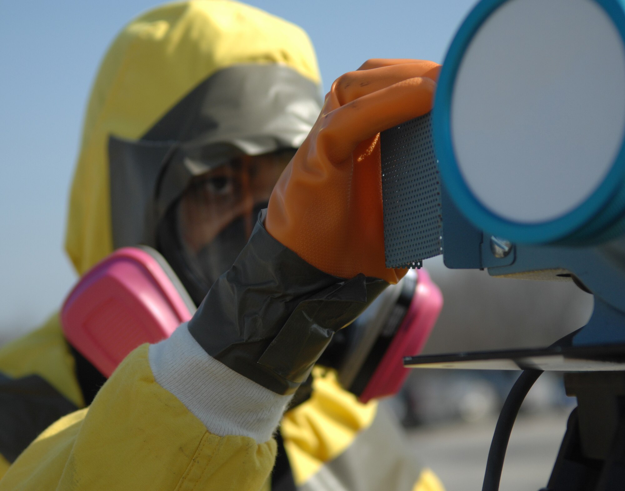 WHITEMAN AIR FORCE BASE, Mo. - Airman 1st Class Eric Hayes, 509th Bioenvironmental Engineering, checks his equipment April 17 during an exercise scenario for the 2009 Air Combat Command Chemical, Biological, Radiological and Nuclear Challenge. The winners of the competition will compete against other CBRN task forces next spring. (U.S. Air Force photo/Senior Airman Stephen Linch)