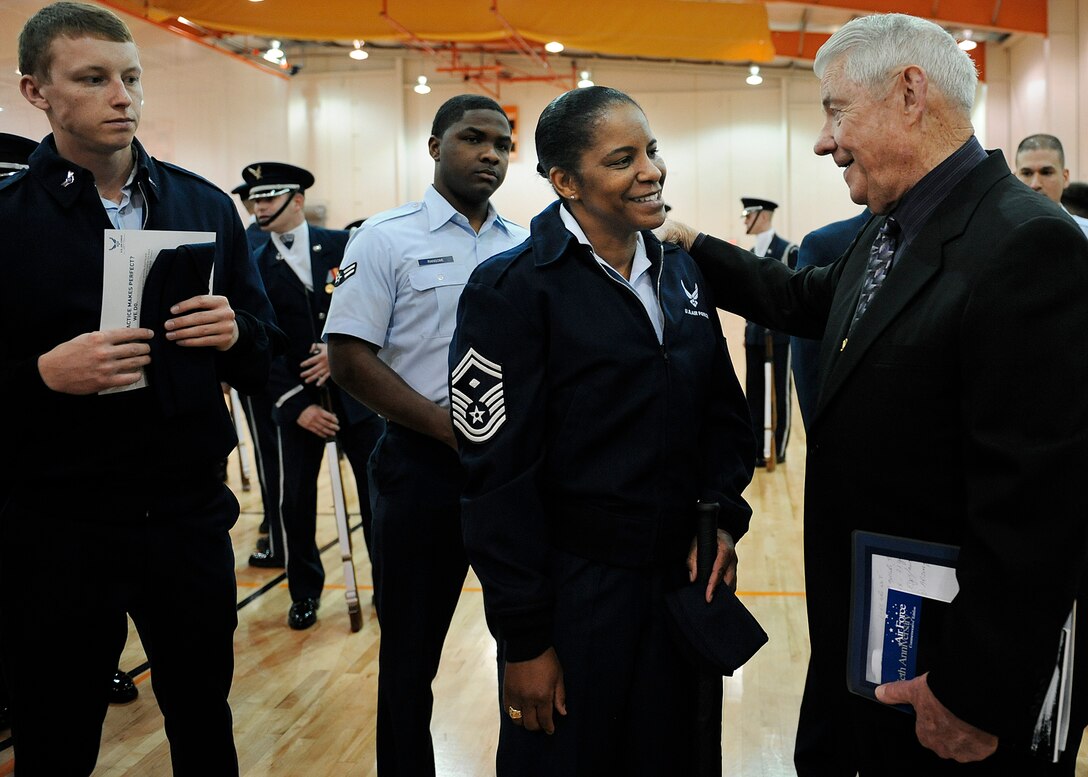 LANGLEY AIR FORCE BASE, Va. --  Retired Chief Master Sgt. of the Air Force Robert D. Gaylor, speaks to Senior Master Sgt. Shelina Frey, 1st Equipment Maintenance Squadron first sergeant, on her recent selection to Chief Master Sergeant during Hampton Roads Air Force Week's Honoring America's Veterans ceremony April 20.  Air Force Week is the Air Force's chance to thank those who support the military through a variety of free events.  (U.S. Air Force photo/Senior Airman Vernon Young)