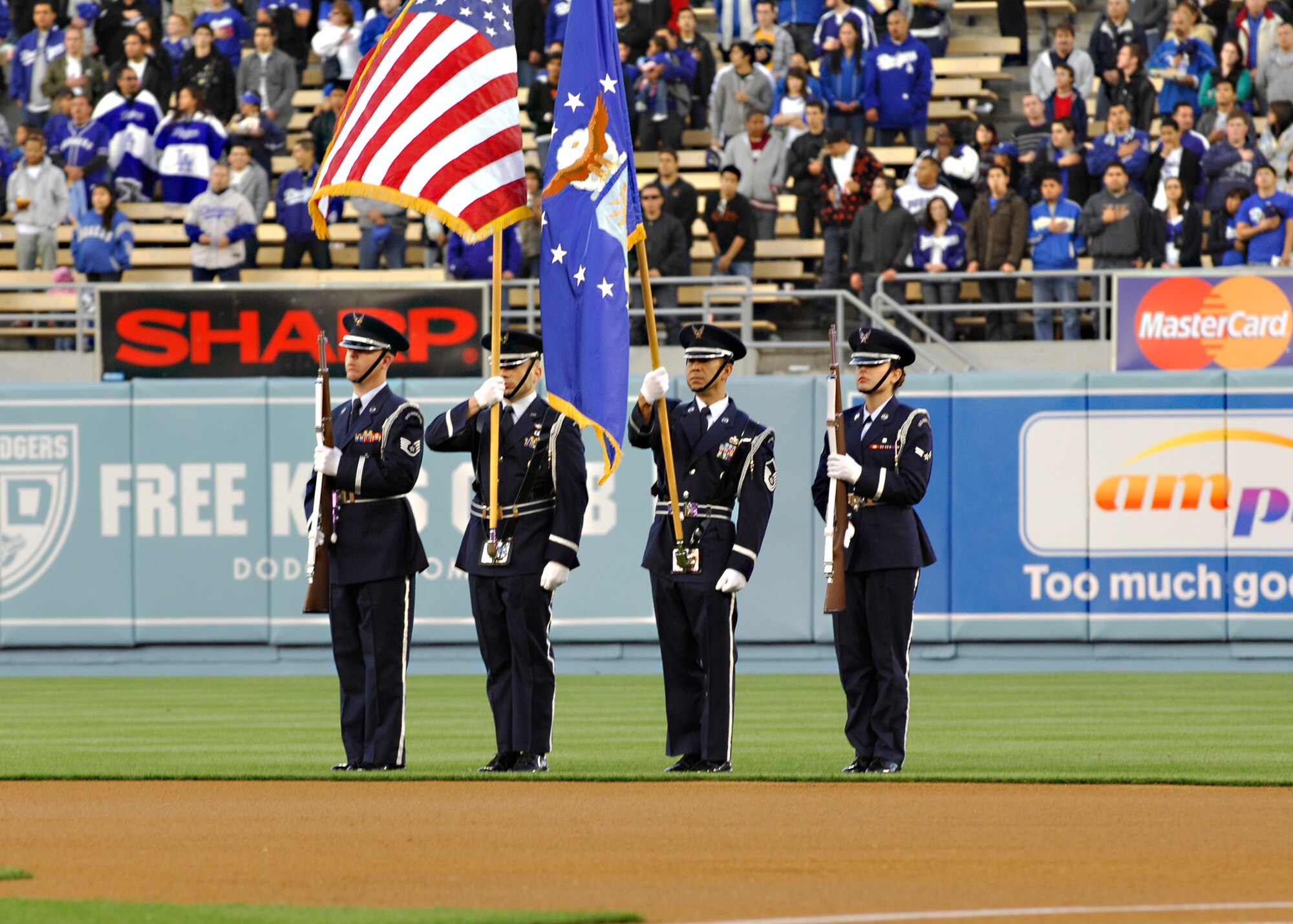 LOS ANGELES --  Vandenberg Air Force Base Honor Guard members present the colors during the opening ceremony at the Los Angeles Dodgers game here April 15. Honor guard members from Vandenberg support a wide variety of base and community functions. (U.S. Air Force photo/Airman 1st Class Heather R. Shaw)
