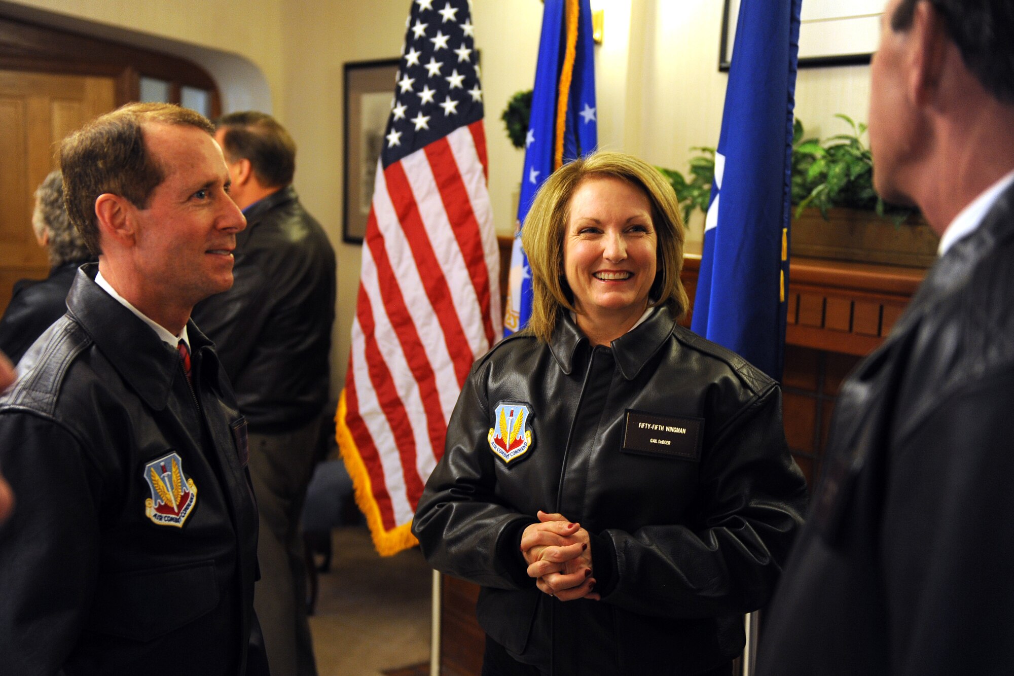 OFFUTT AIR FORCE BASE, Neb. - Gail DeBoer talks to fellow 55th Wing Wingmen Rick Sanders (left) and John Hansen (right) following her induction ceremony April 17. Mrs. DeBoer is the 15th civilian community member to be designated as a 55th WG Wingman for her constant support of Offutt military members and their families.

U.S. Air Force Photo by Josh Plueger
