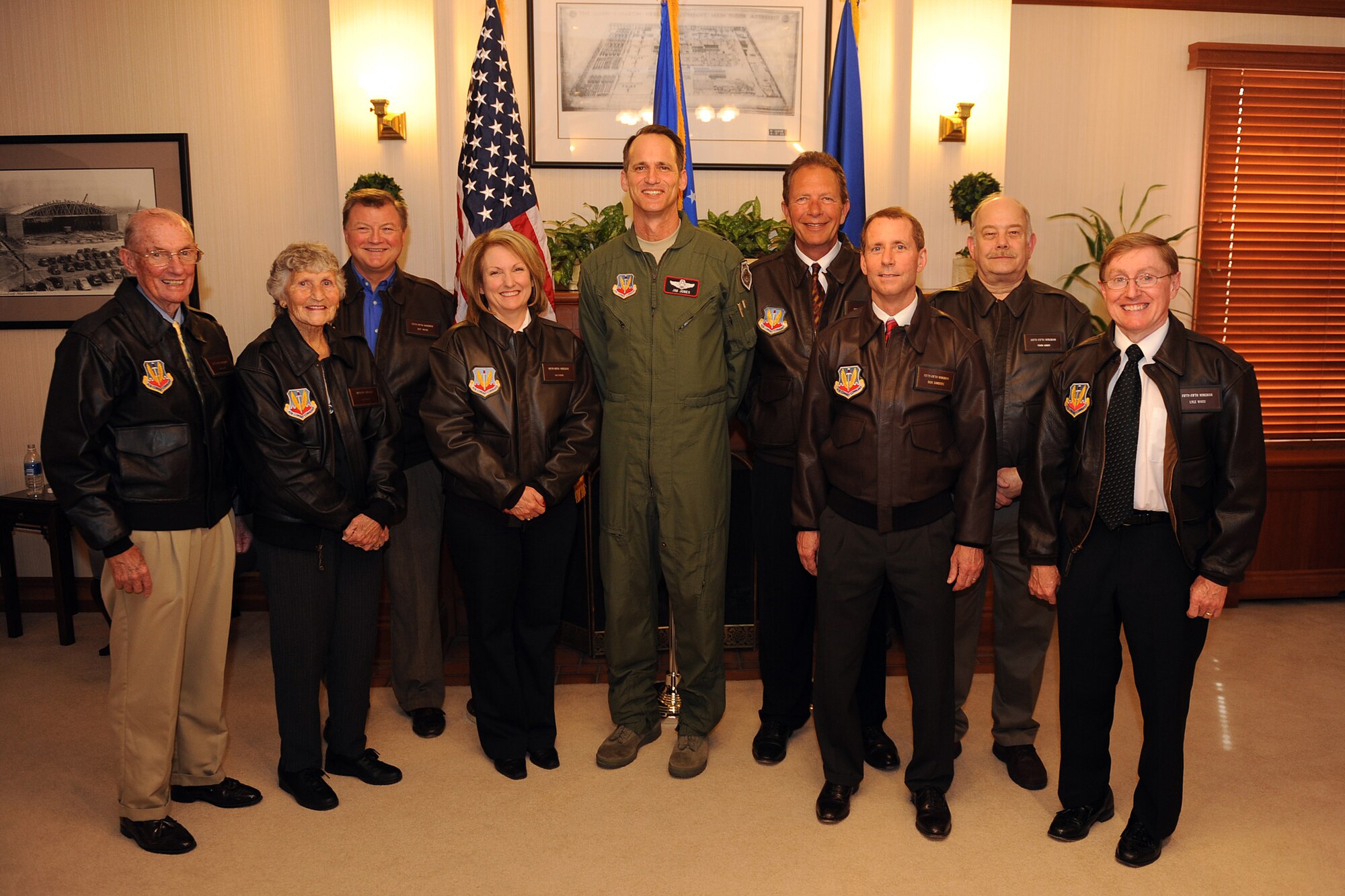 OFFUTT AIR FORCE BASE, Neb. - Newly designated 55th Wing Wingman Gail DeBoer (fourth from left) stands with Brig. Gen. James J. Jones, 55th WG commander, and previous Wingman honorees (from left to right retired 6th Chief Master Sgt. of the Air Force James M. McCoy, Kathy McCoy, Jeff Wilke, Mrs. DeBoer, General Jones, John Hansen, Rick Sanders, Frank Kumor and Lyle Ward) April 17. Mrs. DeBoer is the 15th civilian community member to be selected as a Wingman for her constant support of Offutt military members and their families.

U.S. Air Force Photo By Josh Plueger 