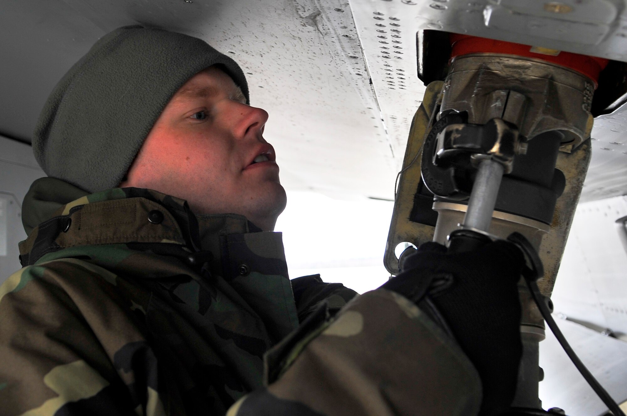 EIELSON AIR FORCE BASE, ALASKA -- Staff Sgt. James George prepares to fuel up an F-16 Fighting Falcon  during RED FLAG-Alaska Apr. 17. RF-A is a Pacific Air Forces-directed field training exercise for U.S. and coalition forces flown under simulated air-combat conditions. Sergeant George is a crew chief assigned to the 132nd FW Aircraft Maintenance Squadron from Des Moines, Iowa. (U.S. Air Force photo/Senior Airman Christopher Boitz)