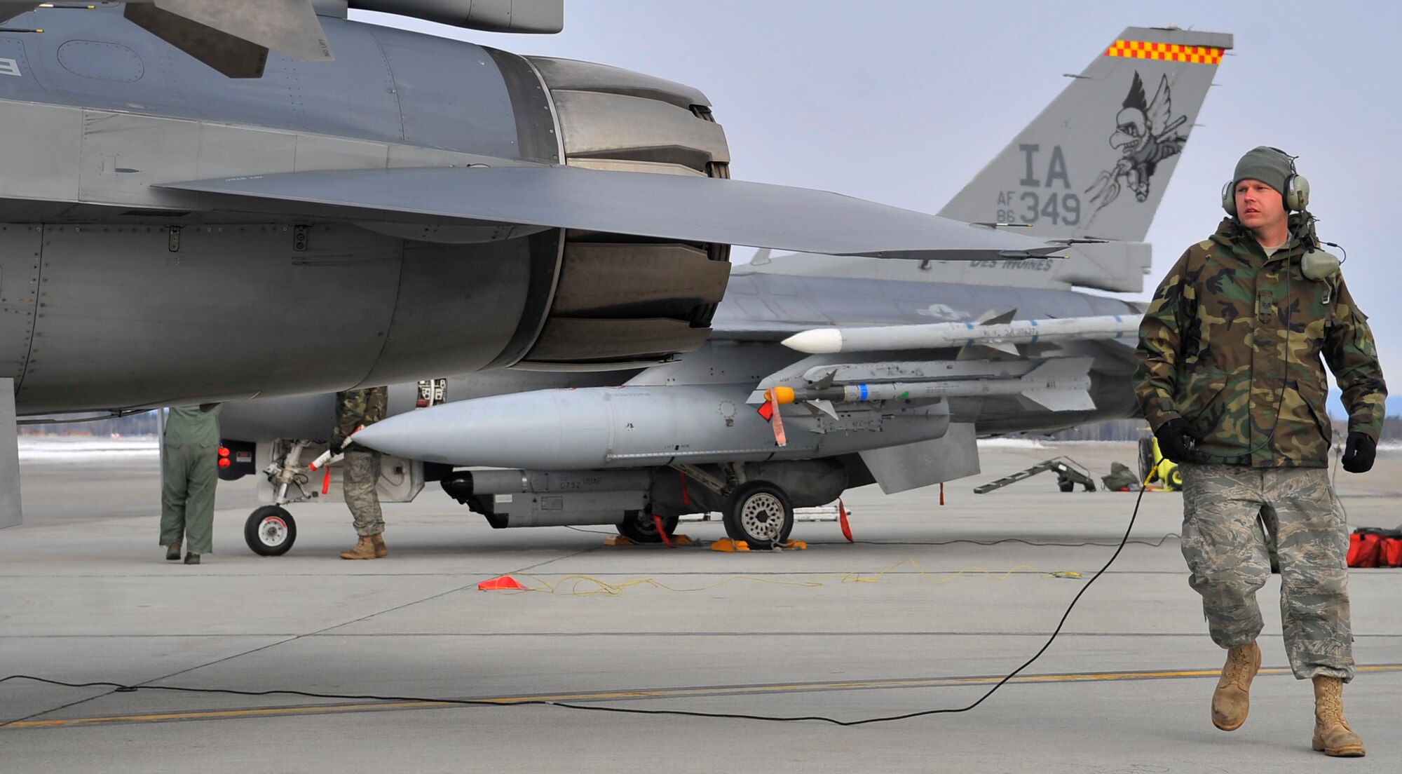 EIELSON AIR FORCE BASE, ALASKA -- Staff Sgt. James George performs a walk-around inspection of an F-16 Fighting Falcon after landing during RED FLAG-Alaska Apr. 17. RF-A is a Pacific Air Forces-directed field training exercise for U.S. and coalition forces flown under simulated air-combat conditions. Sergeant George is a crew chief assigned to the 132nd FW Aircraft Maintenance Squadron from Des Moines, Iowa. (U.S. Air Force photo/Senior Airman Christopher Boitz)