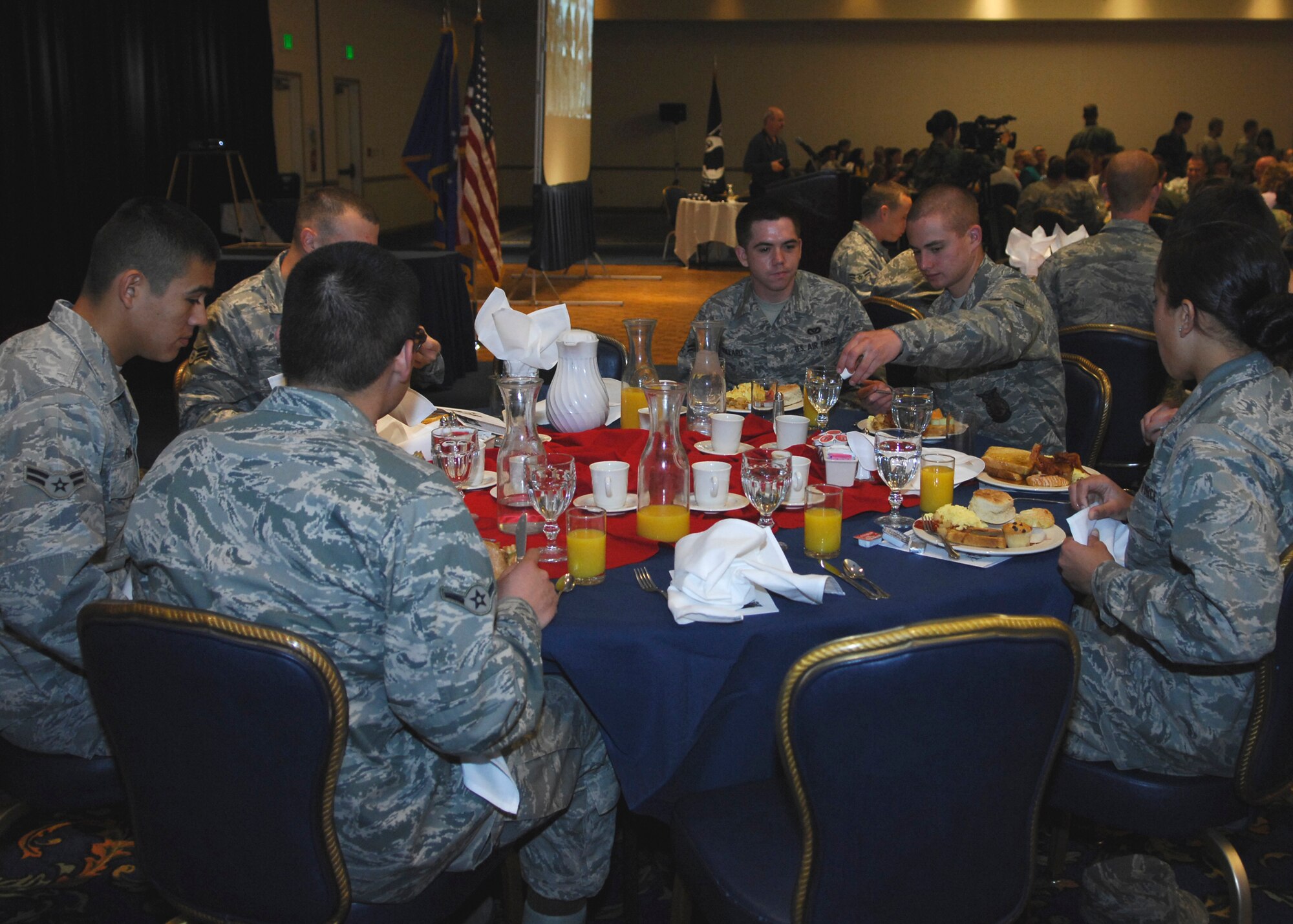 VANDENBERG AIR FORCE BASE, Calif. --  A group of Airmen from differing units share fellowship and enjoy their meals during the National Prayer Breakfast at the Pacific Coast Club here April 15. The breakfast is held annually and provides the opportunity to hear guest chaplains deliver messages. (U.S. Air Force photo/Airman 1st Class Heather R. Shaw)