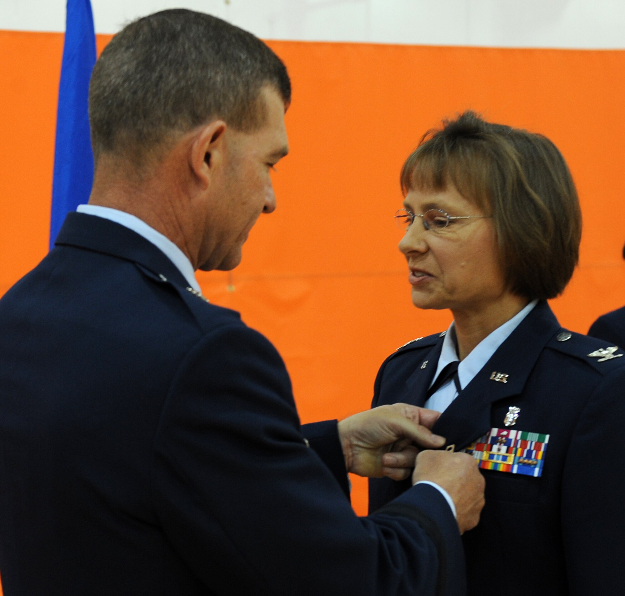 LANGLEY AIR FORCE BASE, Va. -- Col. Rebecca Brown, Air Combat Command Command Surgeon Office, is presented the Bronze Star from Brig. Gen. Mark A. Barrett, 1st Fighter Wing commander, during Hampton Roads Air Force Week's Honoring America's Veterans ceremony April 20.  The Bronze Star Medal is a United States Armed Forces individual military decoration which is awarded for bravery, acts of merit, or meritorious service. (U.S. Air Force photo/Airman 1st Class Zachary Wolf) 
 