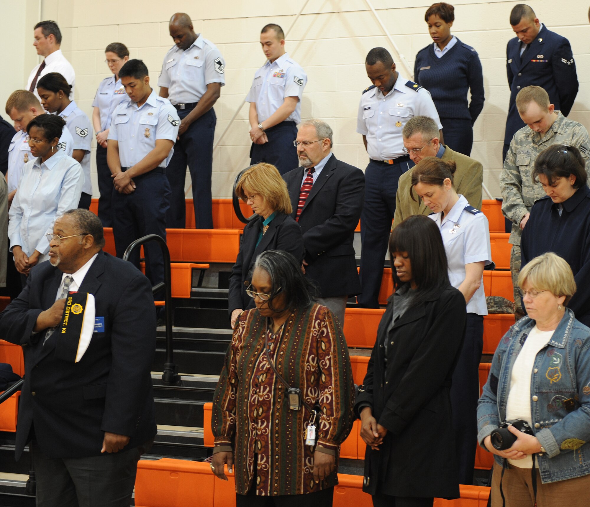 LANGLEY AIR FORCE BASE, Va. -- Attendees of Hampton Roads Air Force Week's Honoring America's Veterans ceremony bow their heads during the invocation April 20.  Air Force Week is the Air Force's chance to thank those who support the military through a variety of free events.  (U.S. Air Force photo/Airman 1st Class Zachary Wolf) 
