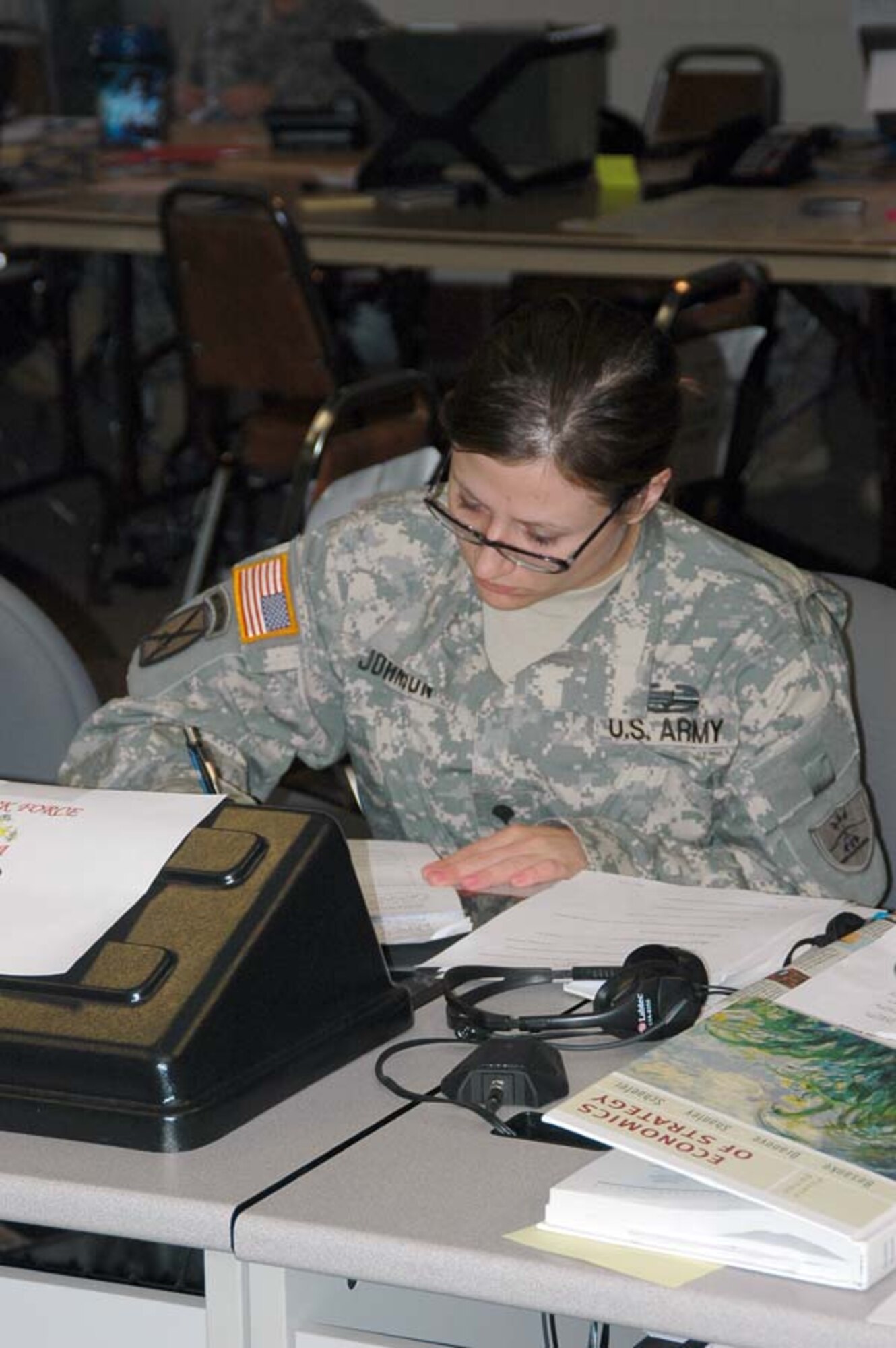 Spc. Danielle Y. Johnson, a member of the 1-188th Air Defense Artillery, studies during down time at the Grand Forks Armed Forces Reserve Center. Johnson is a political science major at North Dakota State University in Fargo, N.D.  
