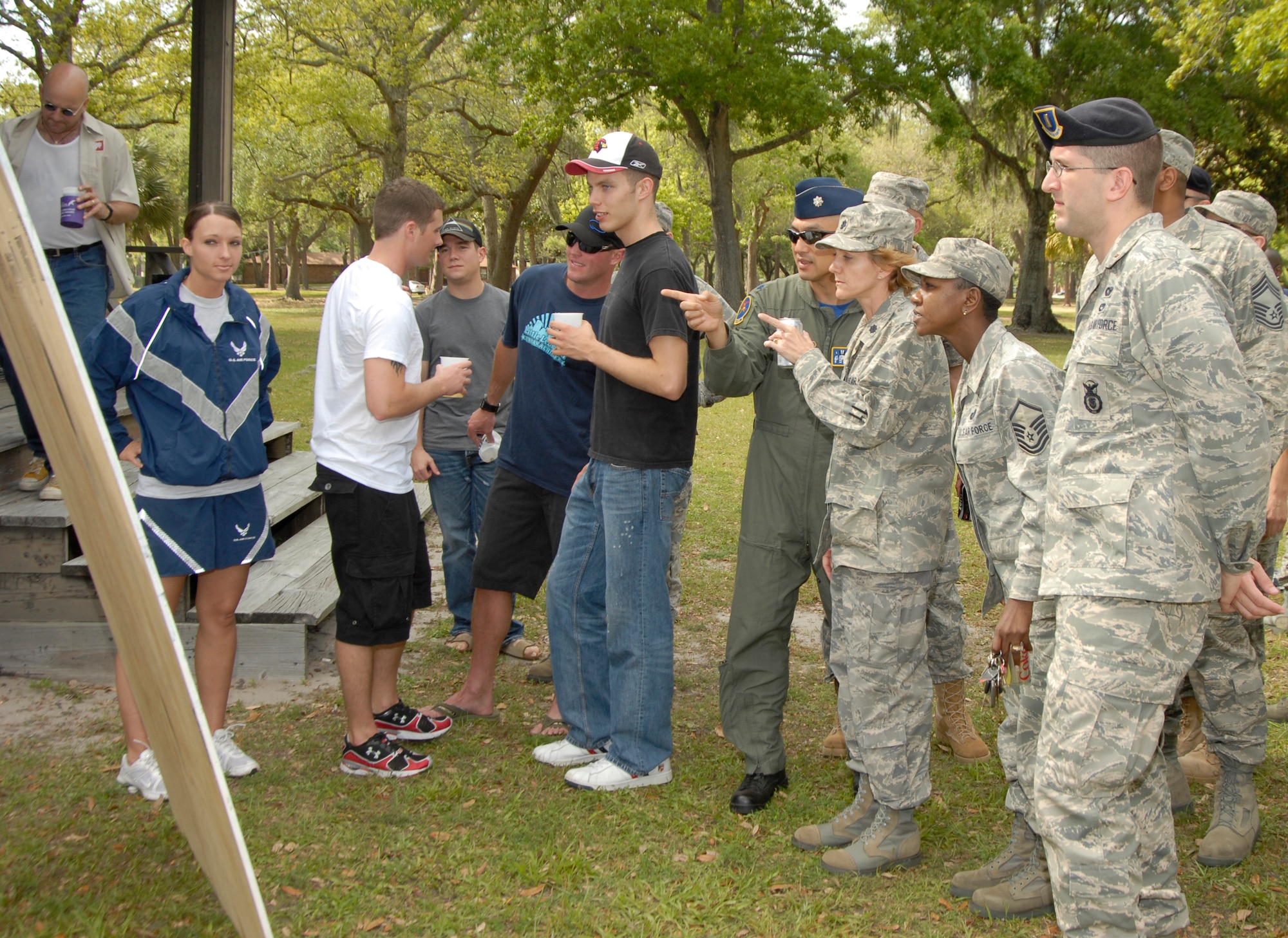 Tyndall community members clamor to see the posted winners of the "Beat the Boss" competition at the 325th Force Support Squadron's "Spring Fling" event April 17at Heritage Park. The 73 who were able to beat the wing commander's physical training score of 93.5 were awarded a three-day pass. The event's purpose was to motivate Airmen through further incentives to strive for excellent scores on PT testing. (U.S. Air Force photo/Robin Walters)