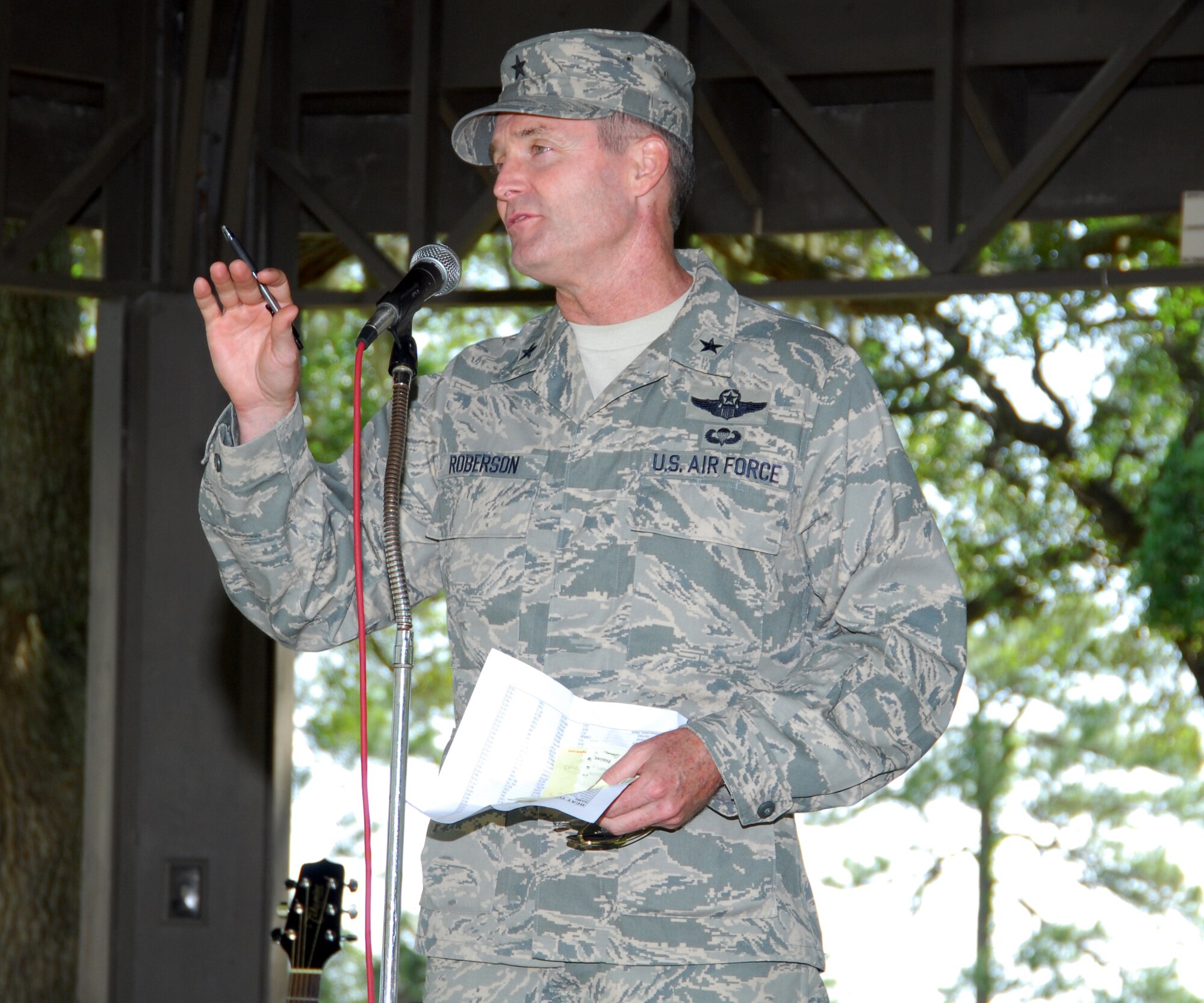 Brig. Gen. Darryl Roberson, 325th Fighter Wing commander, announces April 17 at Heritage Park, here, the winners of the "Beat the Boss" and "Biggest Loser" competitions. Seventy-three Airmen were able to "Beat the Boss" and earn themselves a three-day pass. Of those 73, 31 scored perfect hundreds on their physical training tests. The two military winners of the "Biggest Loser" competition were Senior Airmen John Krieger of the 325th Communications Squadron and Capt. Monica Gomez-Arenas of the 325th Medical Support Squadron. (U.S. Air Force photo/Lisa Norman)