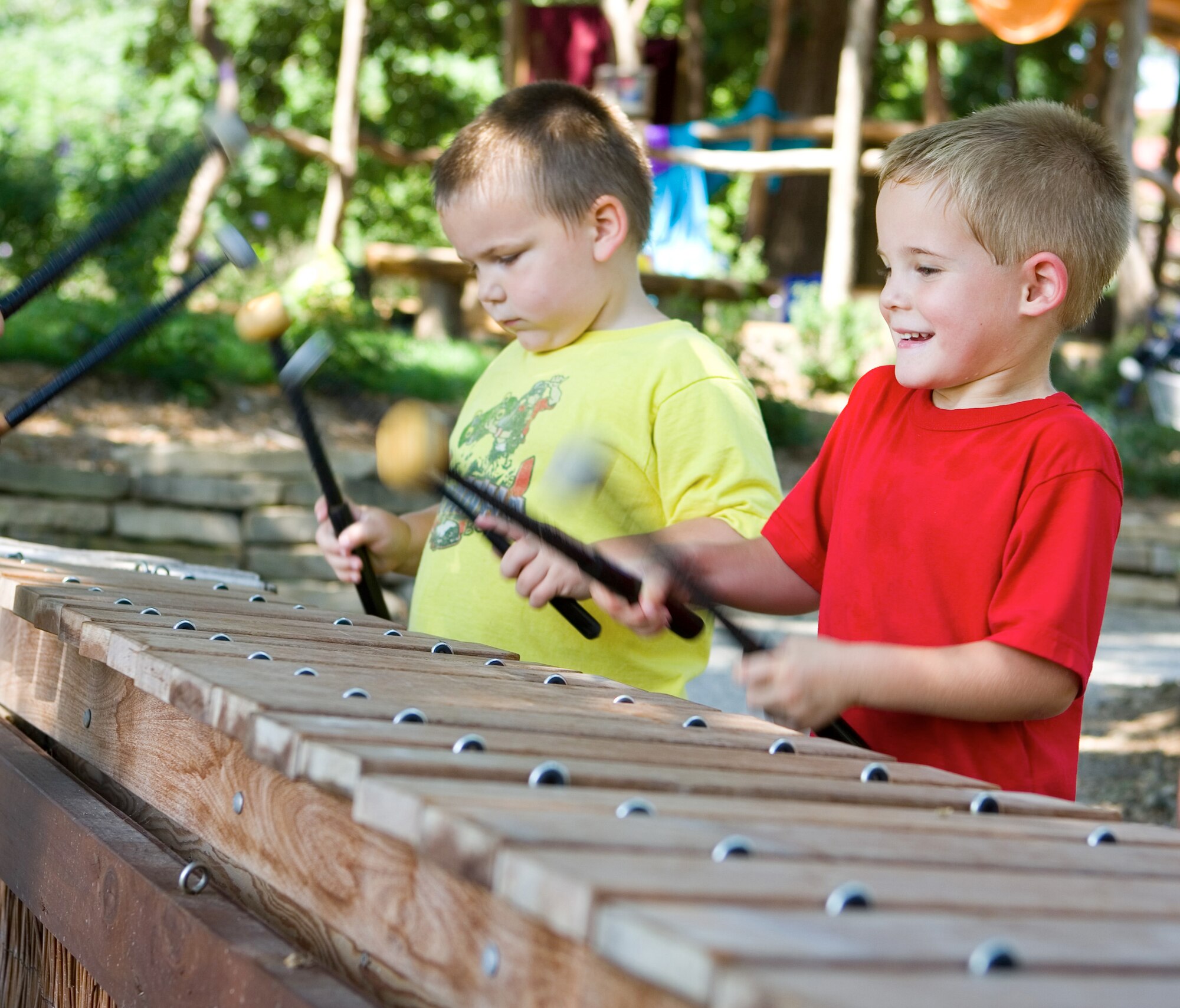 NEBRASKA CITY, Neb. -- Children play the giant meandering marimba in the
Nature Explore Classroom at Arbor Day Farms. With apple blossoms in full
bloom, officials at the farm said April 25 and 26 will be the perfect time
for a visit.  Photo courtesy of Arbor Day Farms.
