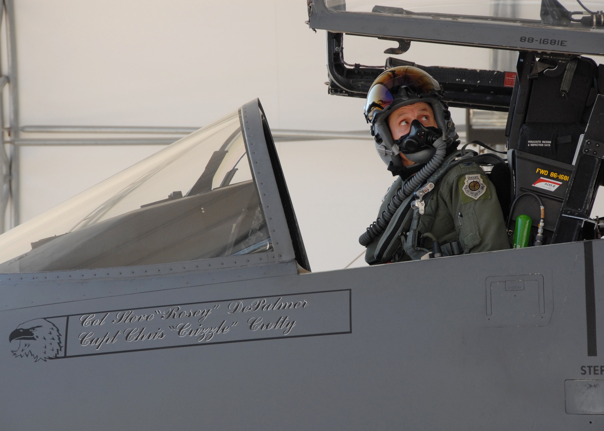 Colonel Steve DePalmer, 53d Wing commander, watches the canopy come down for the last time on his F-15E Strike Eagle, April 17 at Eglin Air Force Base.  He flew his final flight with the wing before being greeted by wing members and family.  Colonel DePalmer leaves the 53d Wing in May, after only a year, to become the vice commander of 14th Air Force.  Photo by Samuel King Jr.