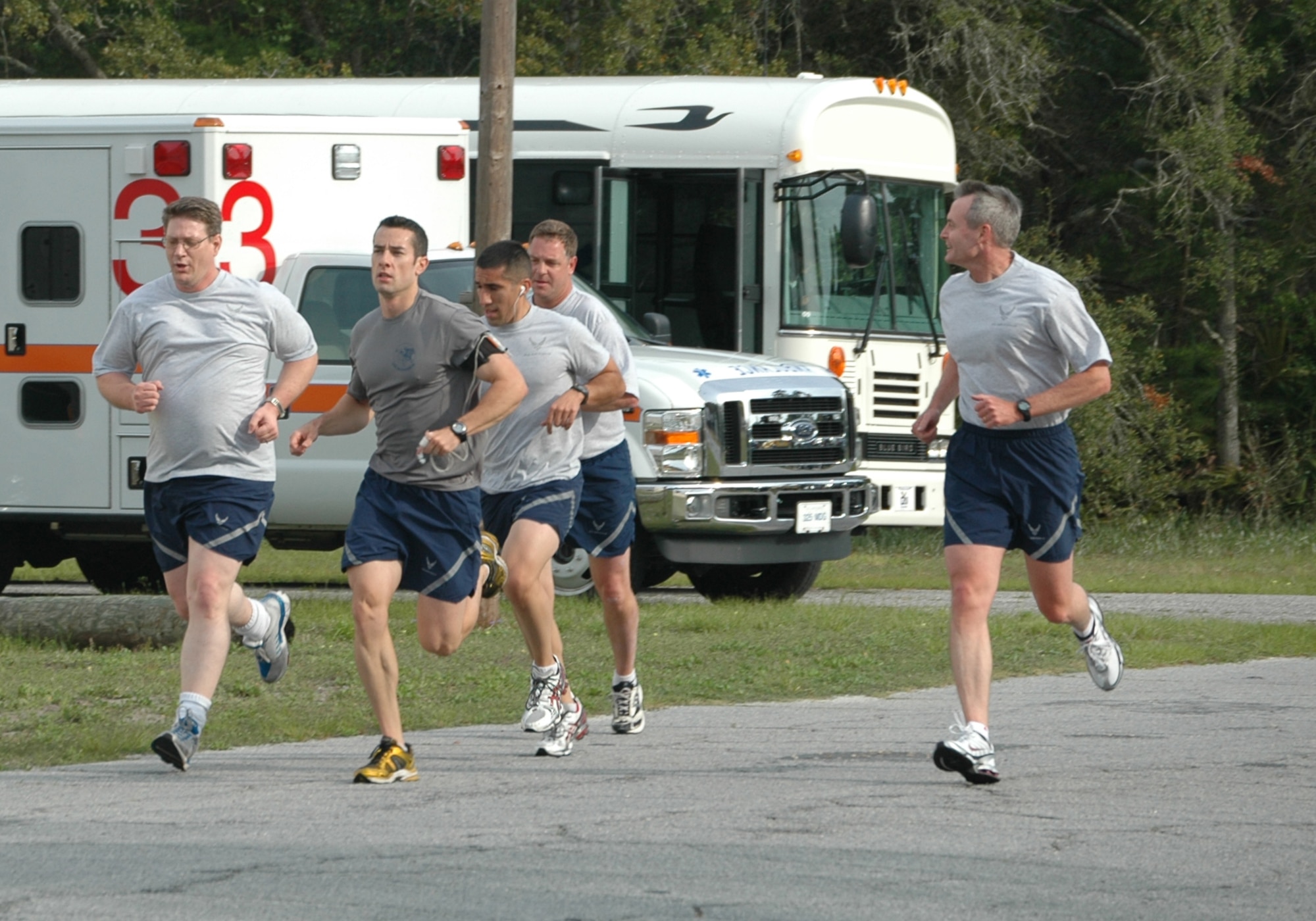 (Right) Brig. Gen. Darryl Roberson, 325th Fighter Wing commander, runs along side fellow Airmen during testing for the "Beat the Boss" competition April 17. The purpose of the competition was to give extra incentive to score excellent during physical training testing by beating the commander's score of 93.5. If accomplished, those Airmen would receive a three-day pass. A total of 104 Airmen competed, and 73 of them "Beat the Boss." A perfect 100 score was acheived by 31 of these Airmen. All Airmen who beat the score were recognized by the commander at the base's "Spring Fling" event in Heritage Park. (U.S. Air Force photo/Airman 1st Class Veronica McMahon)