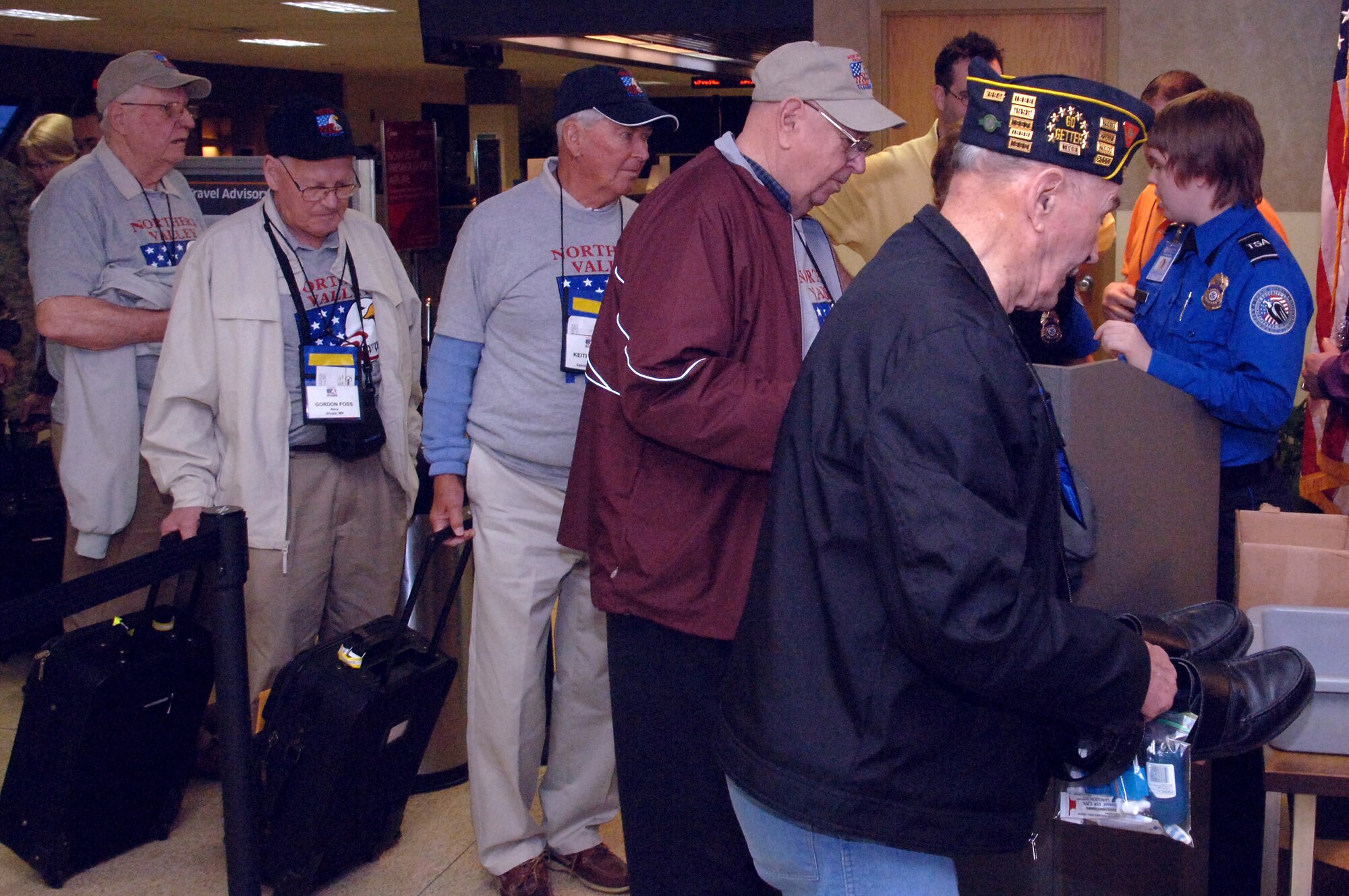 World War II veterans line up at the security check point at Grand Forks International Airport April 17. About 90 veterans participated in the Northern Valley Honor Flight trip to Washington, D.C. (U.S. Air Force photo/Master Sgt. Paul Cox)