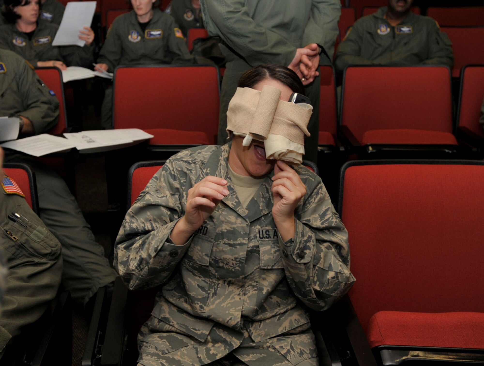 Bandages cover Senior Airman Connor Burkhard's simulated head injury during a self aid and buddy care class Sunday. The class was part of a five-day "frenzy" designed get ancillary training out of the way so 931st Air Refueling Group members can focus on their jobs during future unit training assemblies. Airman Burkhard is assigned to the 931st headquarters staff. (U.S. Air Force photo/Tech. Sgt. Jason Schaap) 