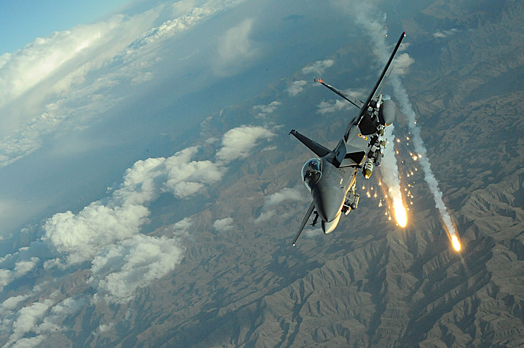 An F-15E Strike Eagle deploys flares during a mission over Afghanistan.  The F-15E provides close-air support and armed overwatch in support of Operation Enduring Freedom.  (U.S. Air Force photo/Staff Sgt. Aaron Allmon)  