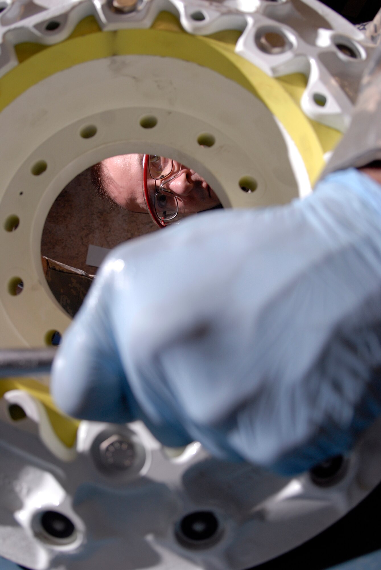 Tech. Sgt. Wayne Birk, 379th Expeditionary Maintenance Squadron hydraulics shop chief, tightens the bolts on a steel brake assembly for a KC-135 Stratotanker, Apr. 17, 2009, at an undisclosed location in Southwest Asia.  The base hydraulic shop supports all of the C-135 airframes in the U.S. Central Command's Area of Responsibility.  Sergeant Birk hails from Brockton, Mass. and is deployed from Grand Forks Air Force Base, N.D. in support of Operations Iraqi and Enduring Freedom and Combined Joint Task Force - Horn of Africa.  (U.S. Air Force photo/Senior Airman Andrew Satran/released)