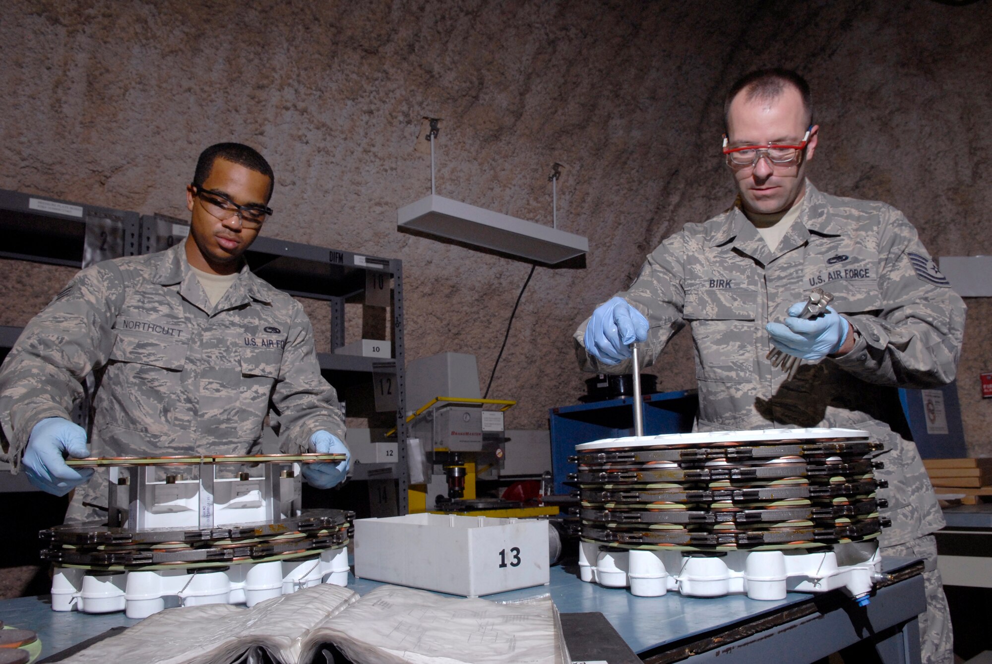 Senior Airman Joseph Northcutt, a 379th Expeditionary Maintenance Squadron (EMXS) hydraulics journeyman, and Tech. Sgt. Wayne Birk, 379th EMXS hydraulic shop chief, assemble two steel brake units for a KC-135 Stratotanker, Apr. 17, 2009, at an undisclosed location in Southwest Asia.  The base hydraulic shop supports all of the C-135 airframes in the U.S. Central Command's Area of Responsibility.    Airman Northcutt hails from Los Angeles, Calif. and is deployed from Fairchild Air Force Base, Wash.  Sergeant Birk hails from Brockton, Mass. and is deployed from Grand Forks Air Force Base, N.D.  Both are deployed in support of Operations Iraqi and Enduring Freedom and Combined Joint Task Force - Horn of Africa.  (U.S. Air Force photo/Senior Airman Andrew Satran/released)