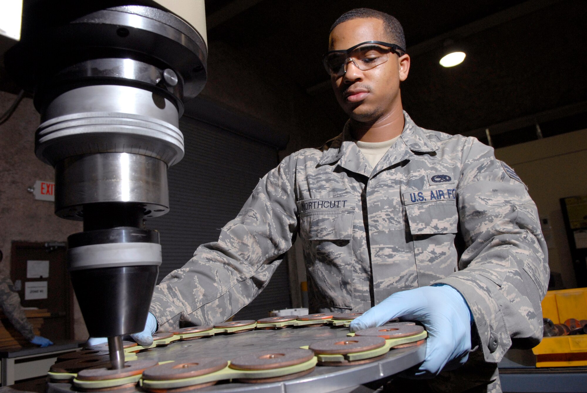 Senior Airman Joseph Northcutt, a 379th Expeditionary Maintenance Squadron hydraulics journeyman, assembles the brake lining for a steel brake assembly from a KC-135 Stratotanker, Apr. 17, 2009, at an undisclosed location in Southwest Asia.  The base hydraulic shop supports all of the C-135 airframes in the U.S. Central Command's Area of Responsibility.  Airman Northcutt hails from Los Angeles, Calif. and is deployed from Fairchild Air Force Base, Wash. in support of Operations Iraqi and Enduring Freedom and Combined Joint Task Force - Horn of Africa.  (U.S. Air Force photo/Senior Airman Andrew Satran/released)