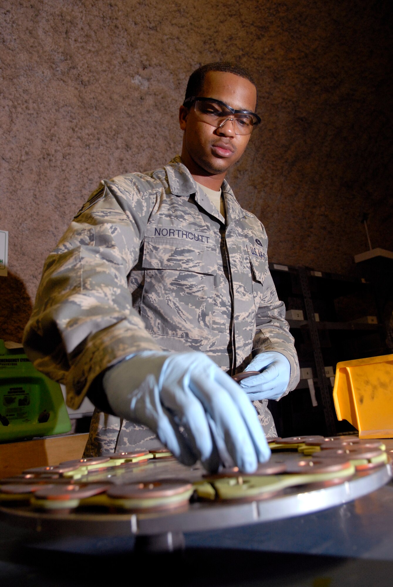 Senior Airman Joseph Northcutt, a 379th Expeditionary Maintenance Squadron Hydraulics Journeyman, assembles the brake lining for a steel brake assembly from a KC-135 Stratotanker, Apr. 17, 2009, at an undisclosed location in Southwest Asia.  The base hydraulic shop supports all of the C-135 airframes in the U.S. Central Command's Area of Responsibility.  Airman Northcutt hails from Los Angeles, Calif. and is deployed from Fairchild Air Force Base, Wash. in support of Operations Iraqi and Enduring Freedom and Combined Joint Task Force - Horn of Africa.  (U.S. Air Force photo/Senior Airman Andrew Satran/released)