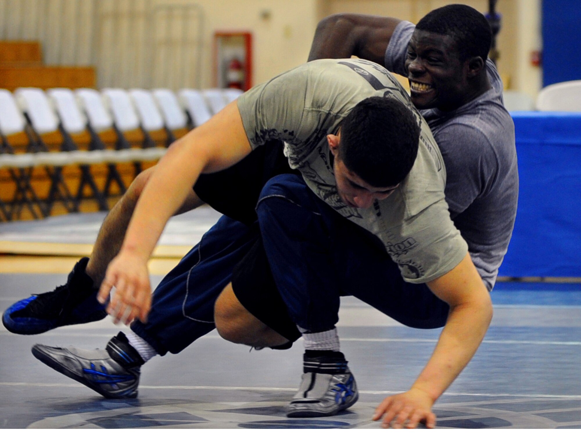 MOUNTAIN HOME AIR FORCE, Idaho -- Airman 1st Class Kevin Justin from Eglin
Air Force Base, Fla., wrestles Airman 1st Class Nader Maghribi from Travis Air Force Base, Calif., as part of the Air Force wrestling team selection competition here Feb. 25.  Airman Justin became one of 11 wrestlers to join the All Air Force Team.  The Air Force athletes take on competitors from other U.S. service branches during the Armed Forces Wrestling Championships, which begin here March 14. (U.S. Air Force photo/ Airman 1st Class Ashley Tank)
