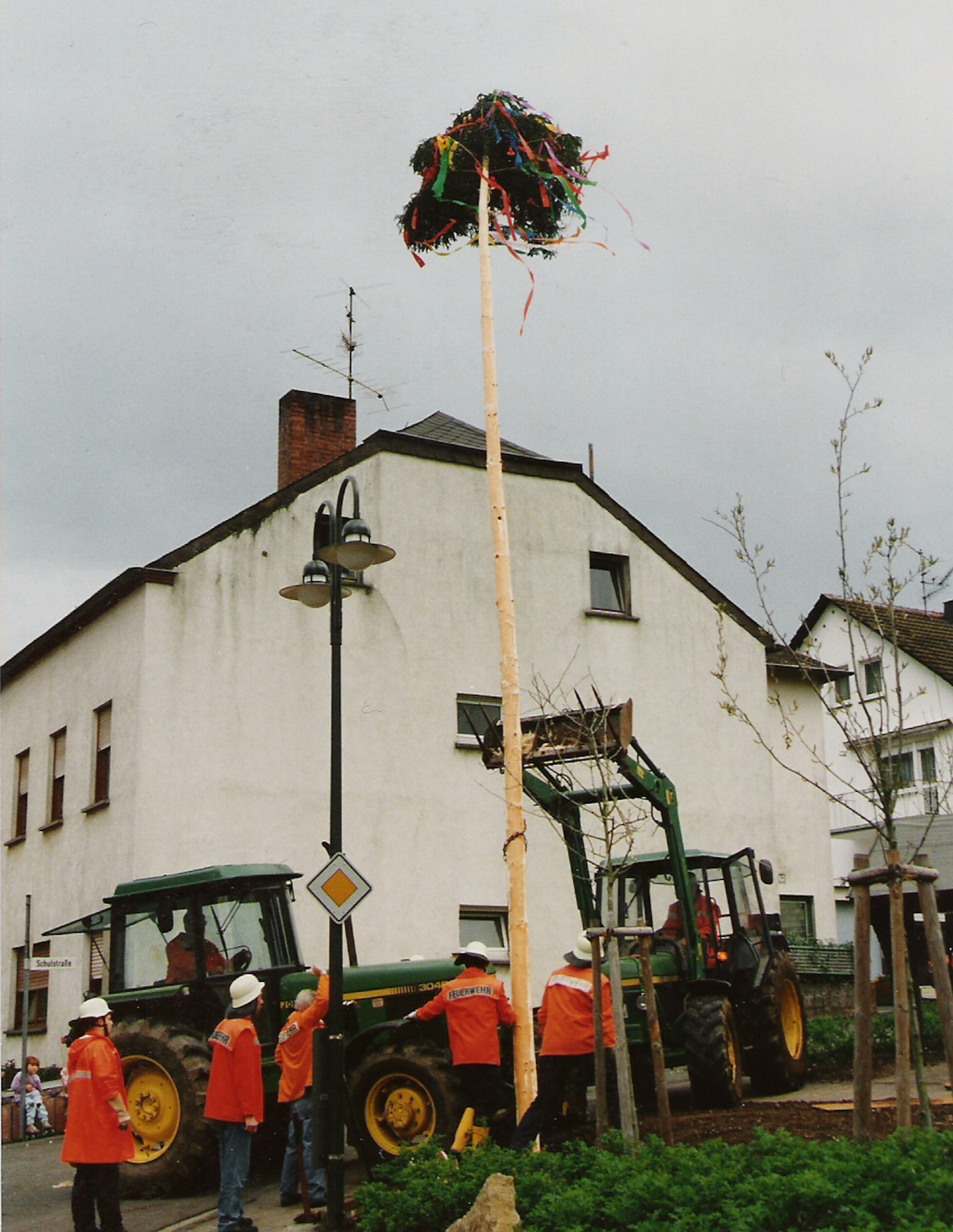 FLIESSEM, Germany --- Local fire fighters set up a May tree in the community of Fliessem, near Bitburg, a day prior to  German Labor Day, which is May 1. The youngsters will guard it around the clock to make sure neighbouring villagers don’t steal it. Traditionally, the May tree is a symbol of freedom. (Photo by Iris Reiff) 