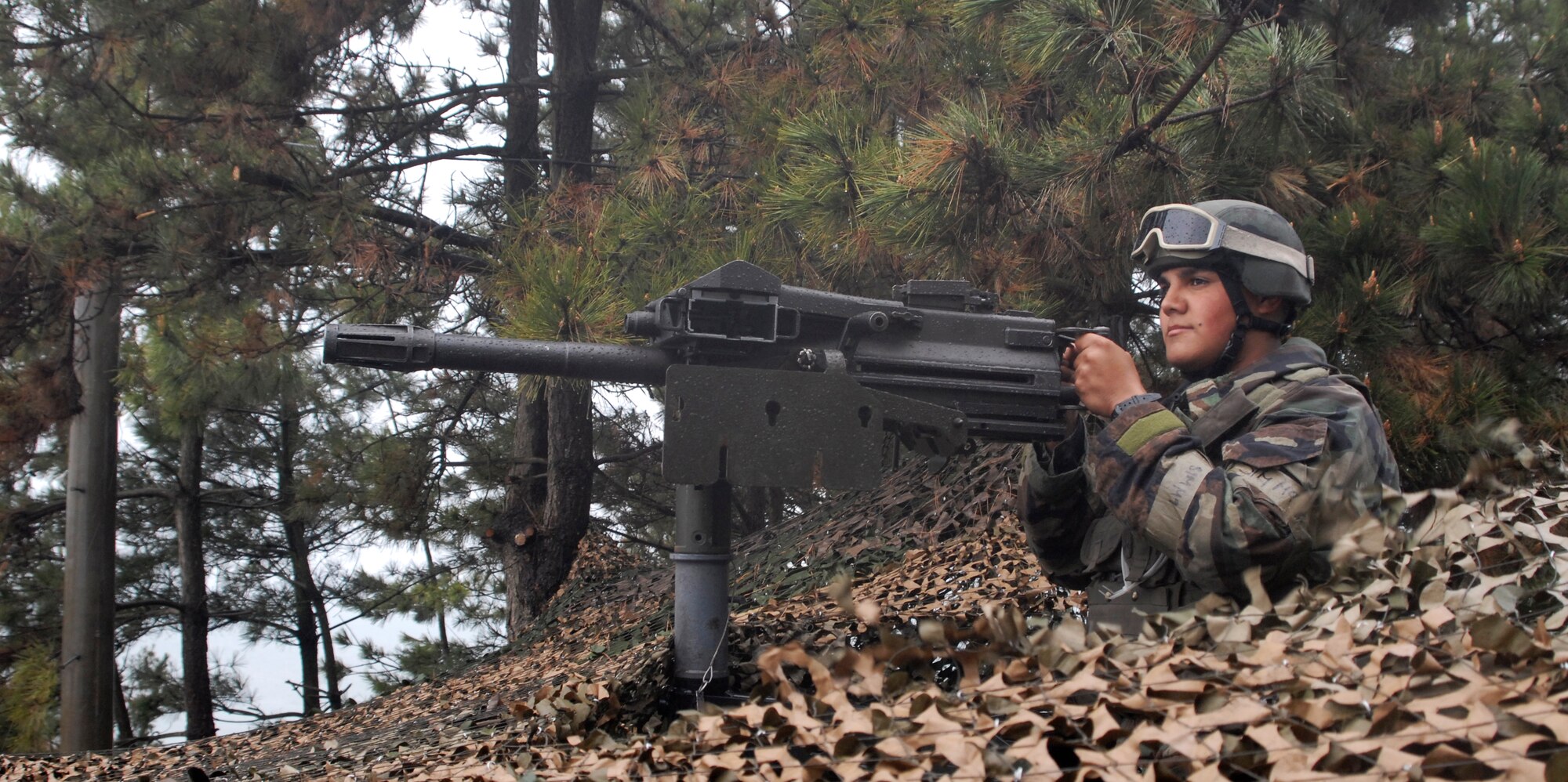 Airman First Class Maximilian Miranda, 8th Security Forces Squadron, scans for hostile forces approaching the base during the Peninsula-Wide Operational Readiness Inspection at Kunsan Air Base, Republic of Korea, April 20, 2009. (U.S. Air Force Photo/Senior Airman Dana Hill)