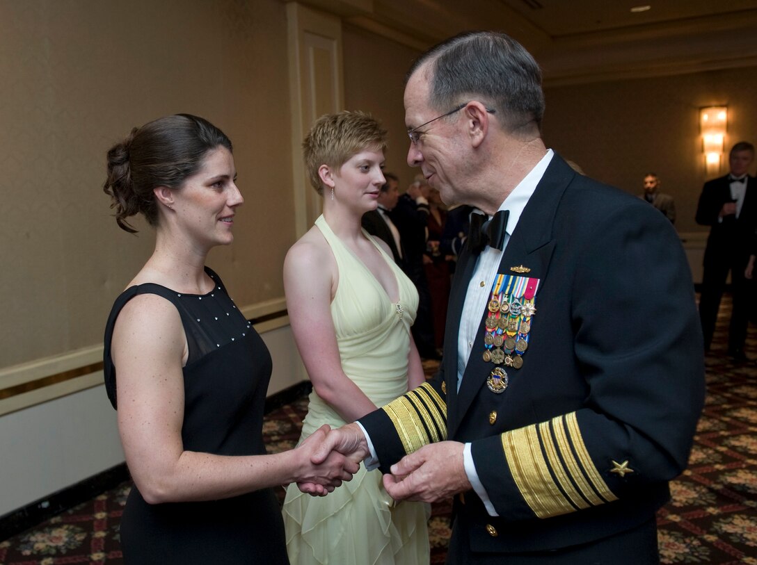 U.S. Navy Adm. Mike Mullen, chairman of the Joint Chiefs of Staff, congratulates two new U.S. Coast Guard enlistees after they took their oath before the Dallas Military Ball, April 18, 2009. Mullen was the guest of honor at the 45th annual event dedicated to honoring active and retired military in the greater Dallas-Fort Worth metropolitan community.