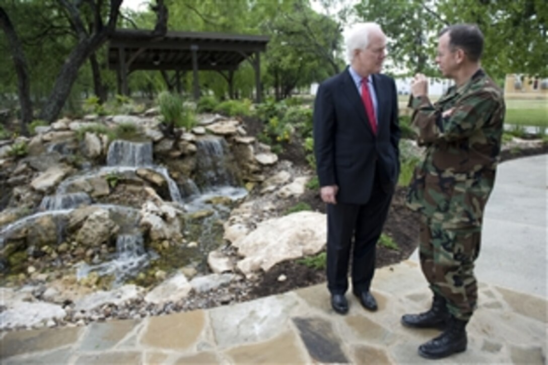 U.S. Navy Adm. Mike Mullen, chairman of the Joint Chiefs of Staff, speaks with Texas Sen. John Cornyn during a tour of the Warrior and Family Support Center at Brooke Army Medical Center, San Antonio, April 17, 2009.