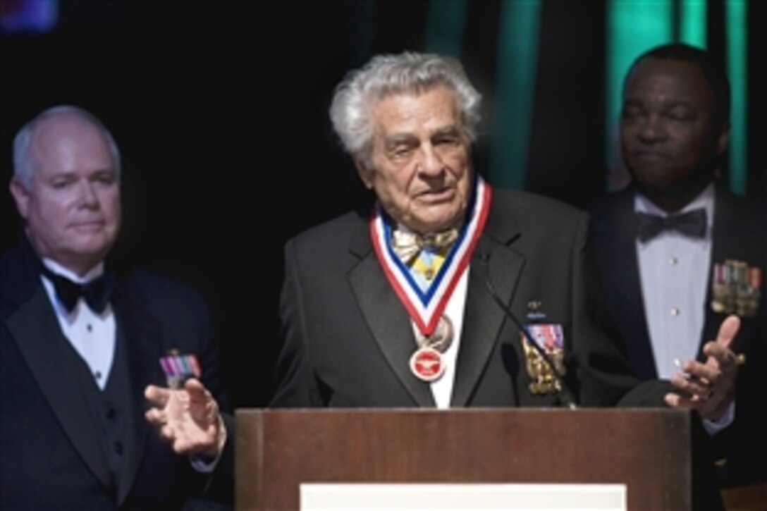 Medal of Honor recipient U.S. Army Lt. Col. James "Maggie" Megellas, the most decorated officer from the 82nd Airborne Division in World War II, addresses the patrons of the Dallas Military Ball after being presented their meritorious service award, April 18, 2009. The 45th annual event was dedicated to honoring active and retired military in the greater Dallas-Fort Worth metropolitan community.