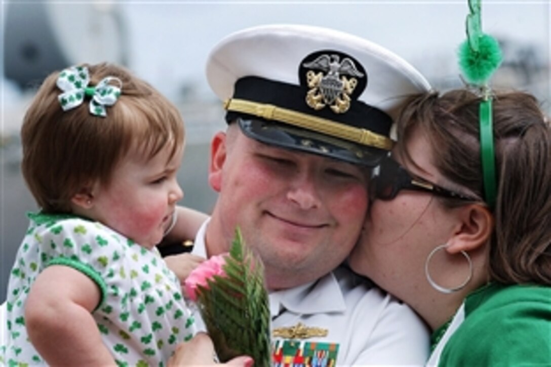 U.S. Navy Lt. Douglas Thompson is greeted by his family during a homecoming celebration for the guided-missile destroyer USS The Sullivans in Mayport, Fla., April 18, 2009. The Sullivans returned after a seven-month deployment.