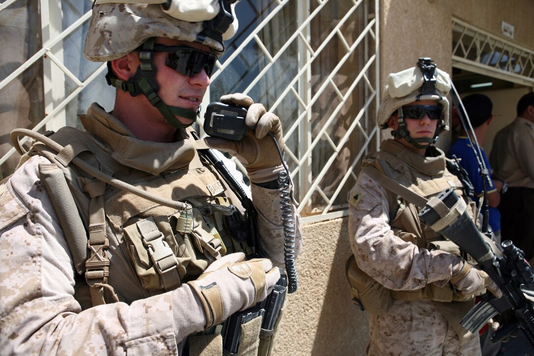 First Lt. Steven Baxter, the platoon commander for Mobile Security Detachment, Regimental Combat Team 8, radios a message to his Marines while providing security at a hospital in Hit, Iraq. MSD is a mixture of Marines from different battalions whom have formed together into one cohesive platoon. “It’s a testament t how professional the small unit leaders have trained these Marines,” Baxter said.