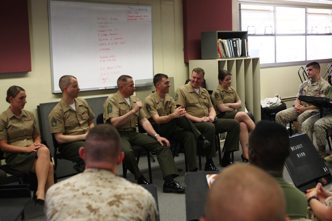 Members of “The President’s Own” United States Marine Band have a question and answer period with the Combat Center band before they begin to practice for the concert April 26 at the Sunset Cinema.
