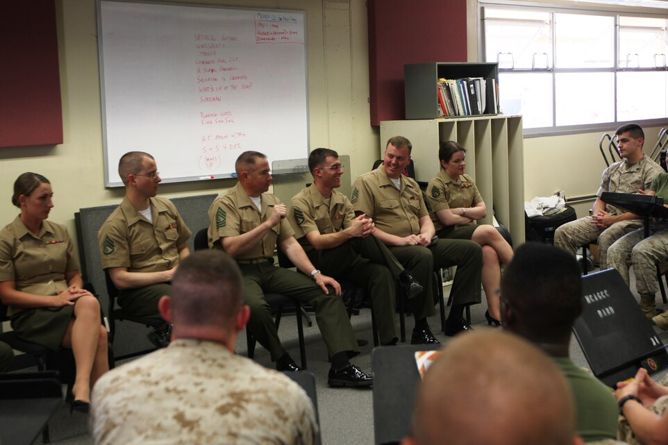 Members of “The President’s Own” United States Marine Band have a question and answer period with the Combat Center band before they begin to practice for the concert April 26 at the Sunset Cinema.