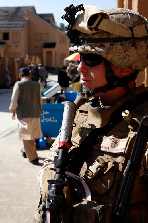 Cpl. Bryan Goldberg, a 21-year-old team leader with Company G, 2nd Battalion, 8th Marine Regiment, 2nd Marine Division, secures a street corner during culture training at the Military Operations in Urban Terrain facility, here, April 21. As squads patrolled through the MOUT facility, role players, mostly foreign nationals, played music, cooked food and manned shops depicting what Marines will encounter while on patrol through a village. (Official U.S. Marine Corps photo by Cpl. Scott Schmidt.) (RELEASED)