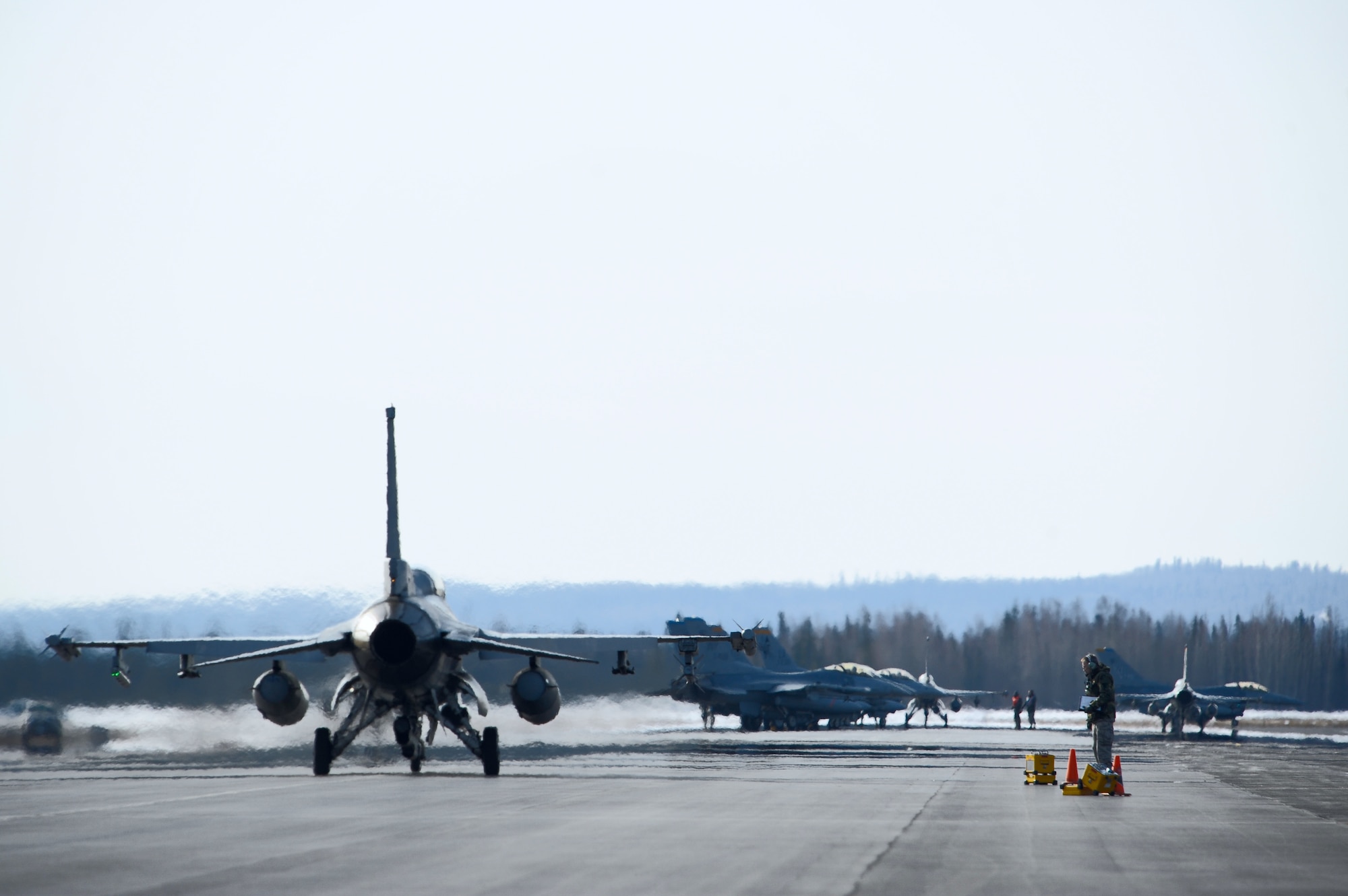 An F-16 Fighting Falcon, 35th Fighter Squadron, Kunsan Air Base, Korea, taxis towards the end of the runway during RED FLAG-Alaska 09-2 April 21, 2009, Eielson Air Force Base, Alaska. RF-A is a series of Pacific Air Forces commander-directed field training exercises for U.S. forces, providing joint offensive counter-air, interdiction, close air support, and large force employment training in a simulated combat environment.  (U.S. Air Force Photo/Senior Airman Jonathan Snyder)