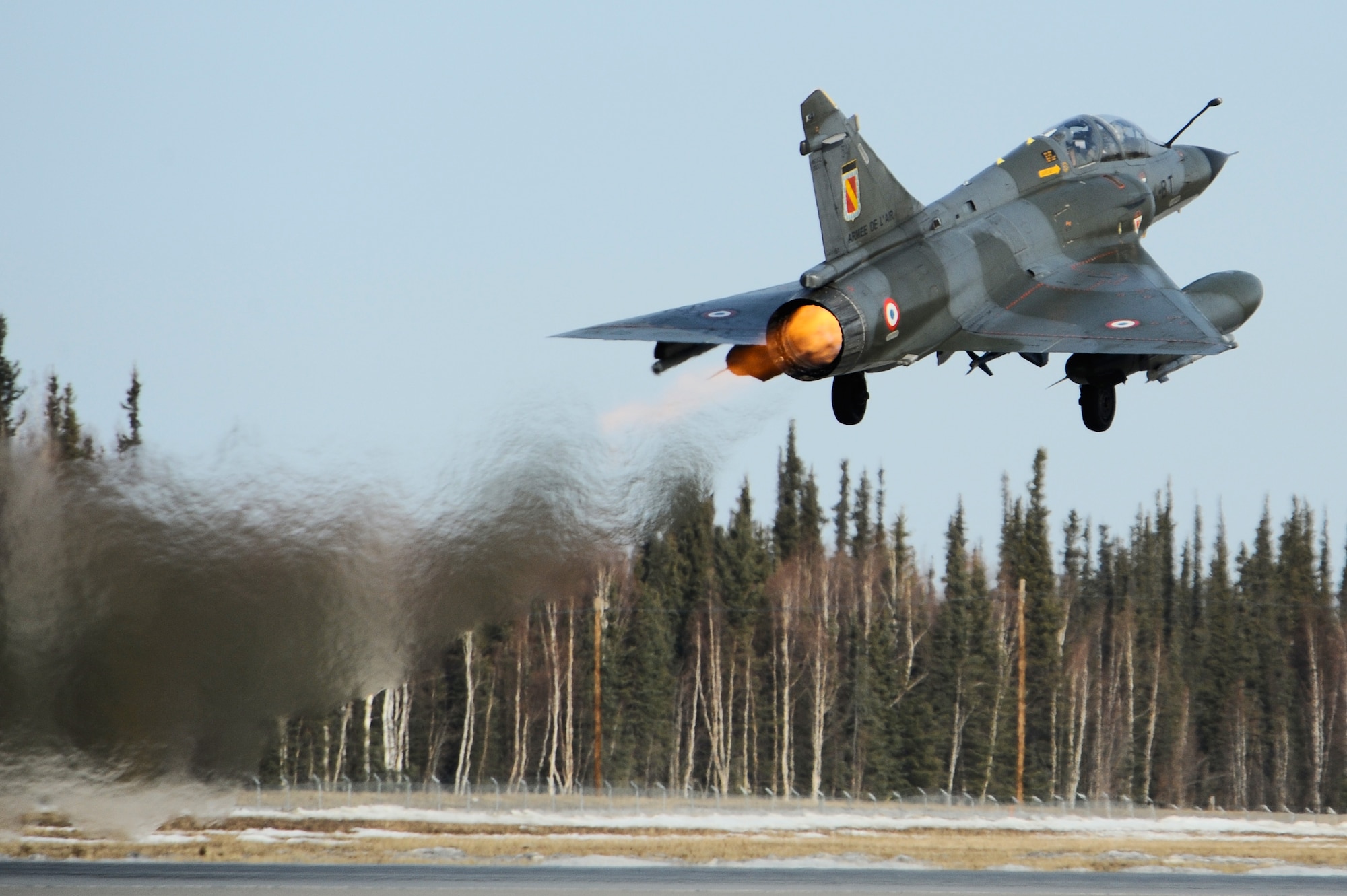 A French Dassault M2000 Mirage takes off for the Joint Pacific Alaskan Range Complex during RED FLAG-Alaska 09-2 April 21, 2009, Eielson Air Force Base, Alaska. This exercise provides unique opportunities to help integrate various forces into joint, coalition, and bilateral training from simulated forward operating bases.  (U.S. Air Force Photo/Senior Airman Jonathan Snyder)