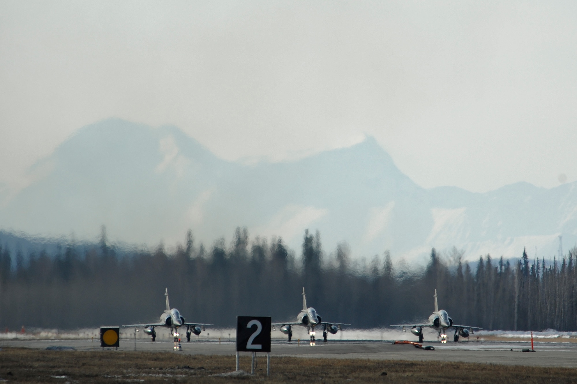 Three French Dassault M2000 Mirages prepare to take off during RED FLAG-Alaska 09-2 April 21, 2009, Eielson Air Force Base, Alaska. This exercise provides unique opportunities to help integrate various forces into joint, coalition, and bilateral training from simulated forward operating bases.  (U.S. Air Force Photo/Senior Airman Jonathan Snyder)