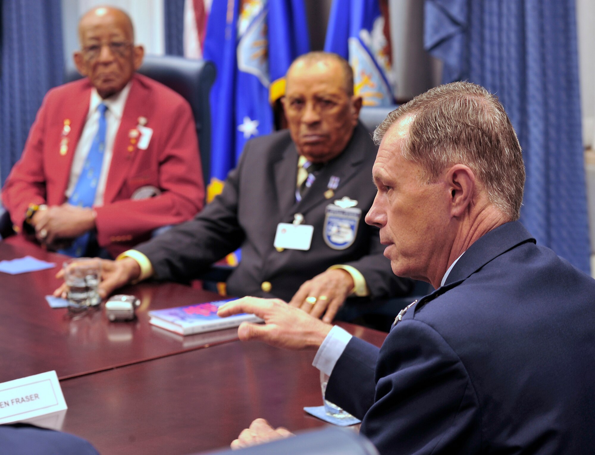 Air Force Vice Chief of Staff Gen. William Fraser III (right) talks with Tuskegee Airmen including James C. Warren and Phillip Broome in the Pentagon April 20.  Four Tuskegee Airmen and retired Lt. Gen. Russell Davis were in Washington to meet with General Fraser and Air Force Chief of Staff Gen. Norton Schwartz prior to departing on a tour of units in Southwest Asia including the 332nd Air Expeditionary Wing whose origins trace back to the 332nd Fighter Group and the Tuskegee Red Tail Flyers.  (U.S. Air Force photo/Scott M. Ash)