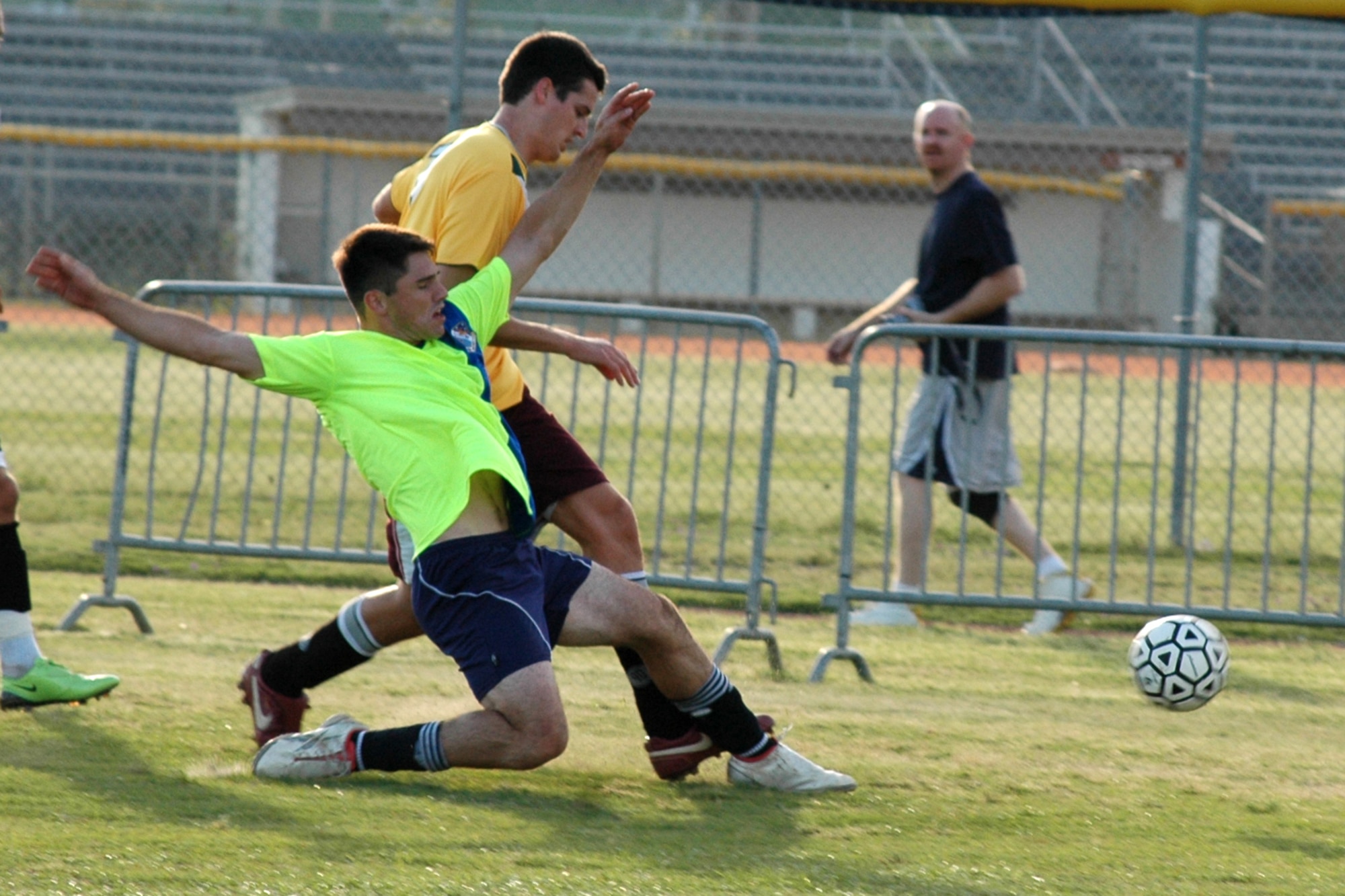 EGLIN AIR FORCE BASE, Fla. -- A player from the 53rd Wing slides to kick the ball from his opponent. The 53rd were crowned champions when the met the 46th Test Wing at the base Intramural Soccer Chamionship, after winning in a sudden death shootout in overtime April 16. (U.S. Air Force photo/ Airman Anthony Jennings)
