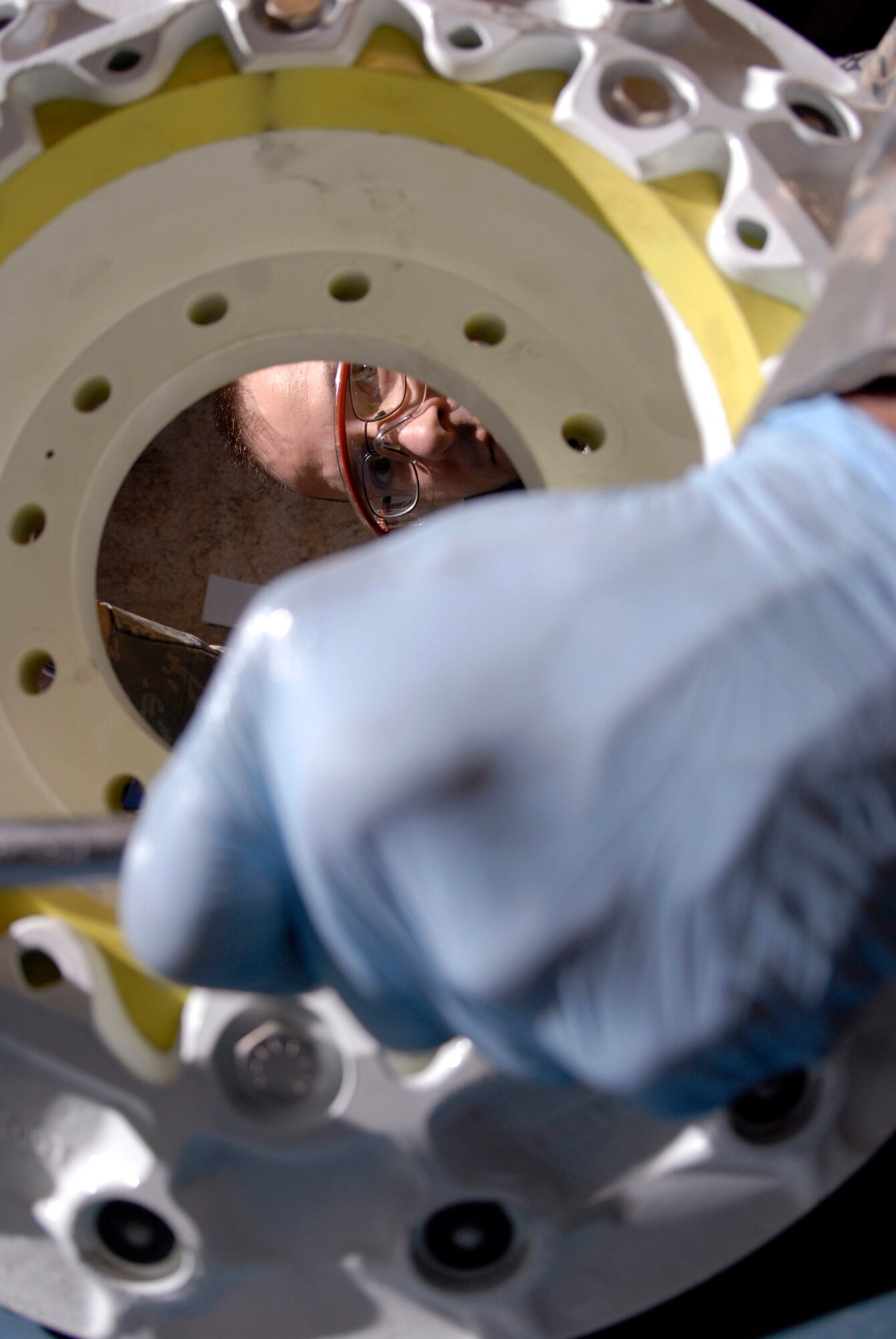 Tech. Sgt. Wayne Birk tightens the bolts on a KC-135 Stratotanker steel brake assembly April 17 at an air base in Southwest Asia.  Sergeant Birk is the 379th Expeditionary Maintenance Squadron hydraulics shop chief,  and is from Brockton, Mass.  (U.S. Air Force photo/Senior Airman Andrew Satran)