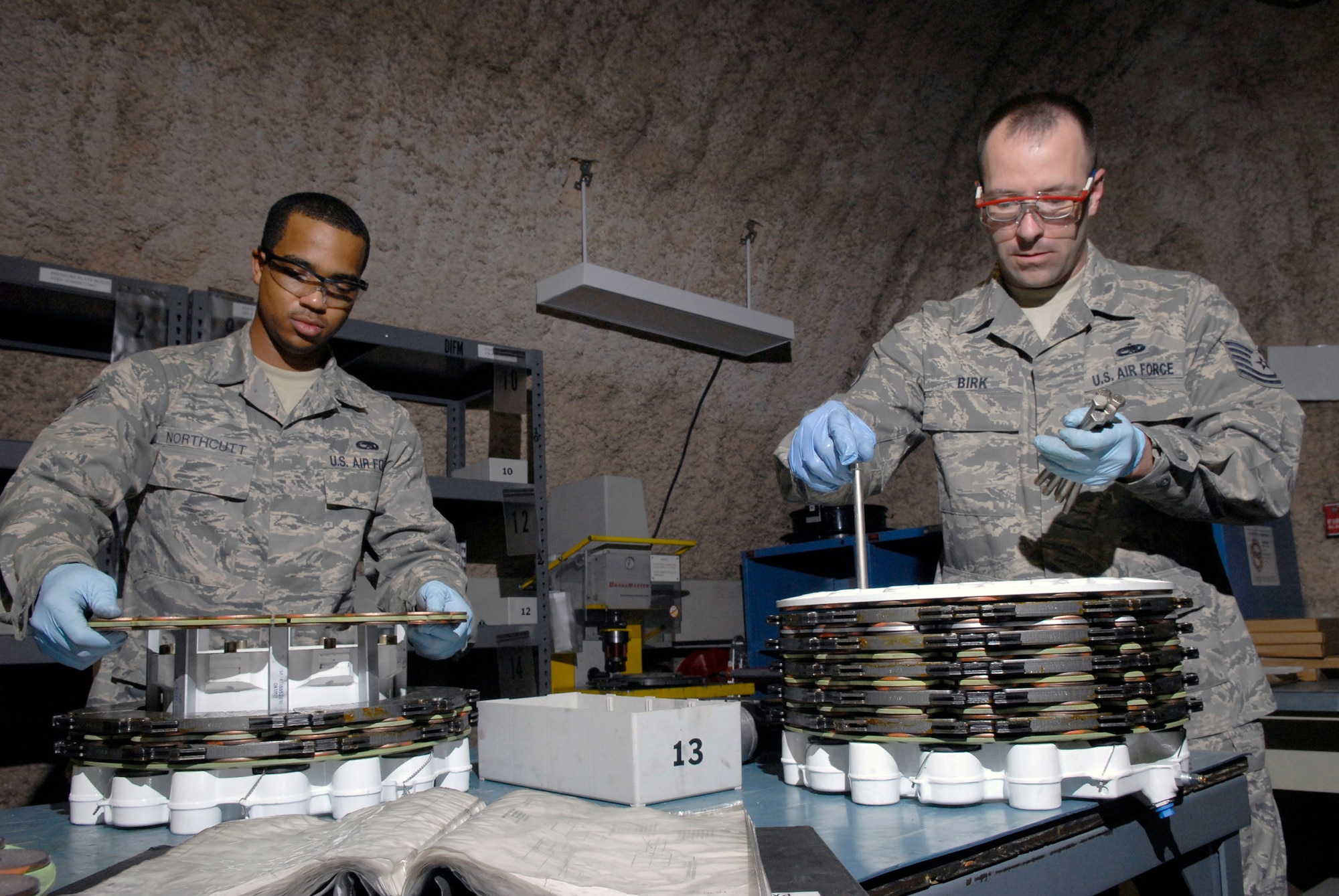 Senior Airman Joseph Northcutt and Tech. Sgt. Wayne Birk assemble two KC-135 Stratotanker steel brake units April 17 at an air base in Southwest Asia.  Both Airmen are assigned to 379th Expeditionary Maintenance Squadron hydraulics shop which supports all of the C-135 airframes in the U.S. Central Command's area of responsibility. (U.S. Air Force photo/Senior Airman Andrew Satran)