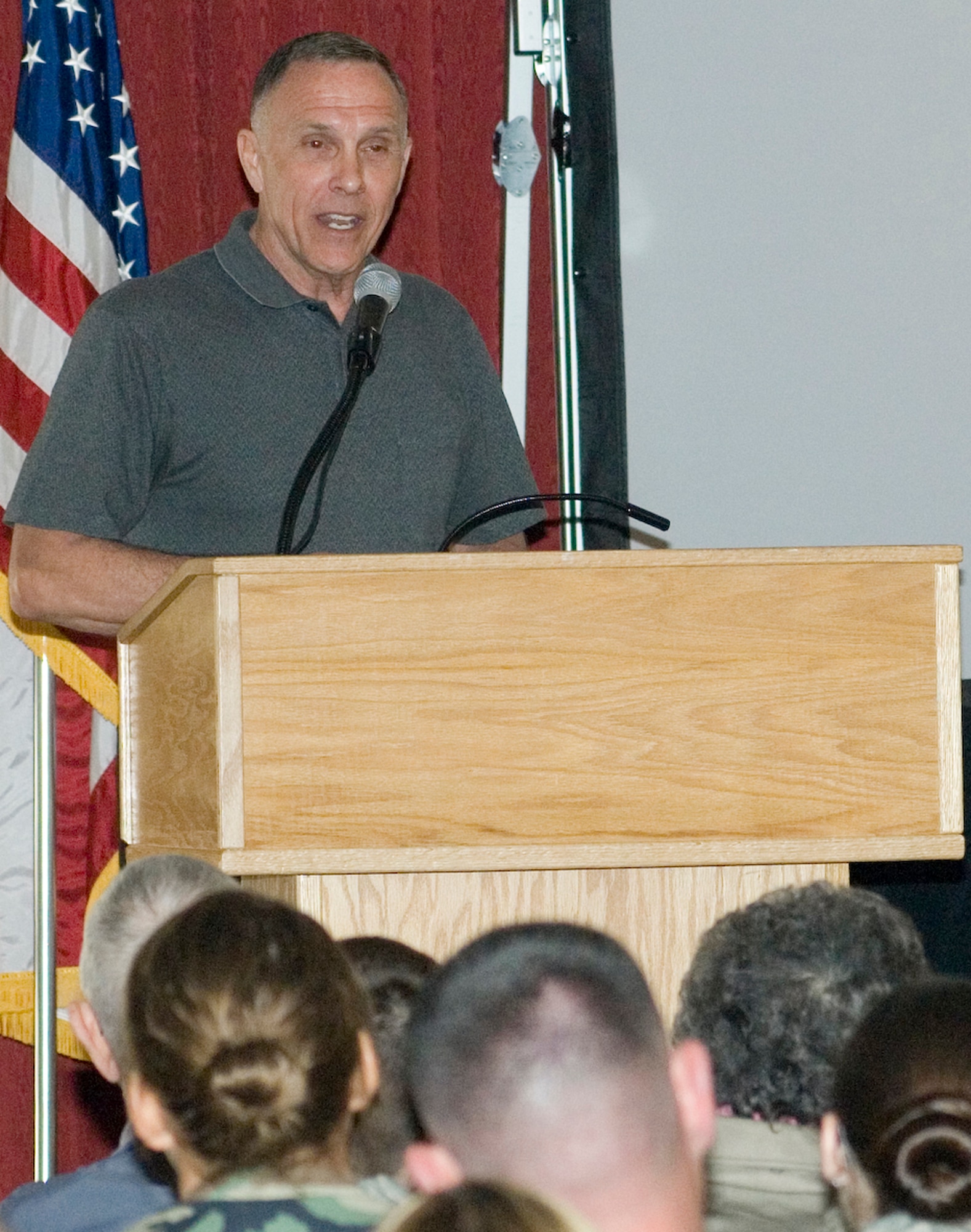 One of three speakers at the Heritage of Freedom speaker series, retired Air Force Chief Master Sgt. Wayne Fisk recounts his Vietnam-era experiences to a packed crowd April 15 at Hanscom Air Force Base, Mass. The three speakers in this quarterly event discuss their experiences serving in combat or while deployed. (U.S. Air Force photo/Rick Berry)